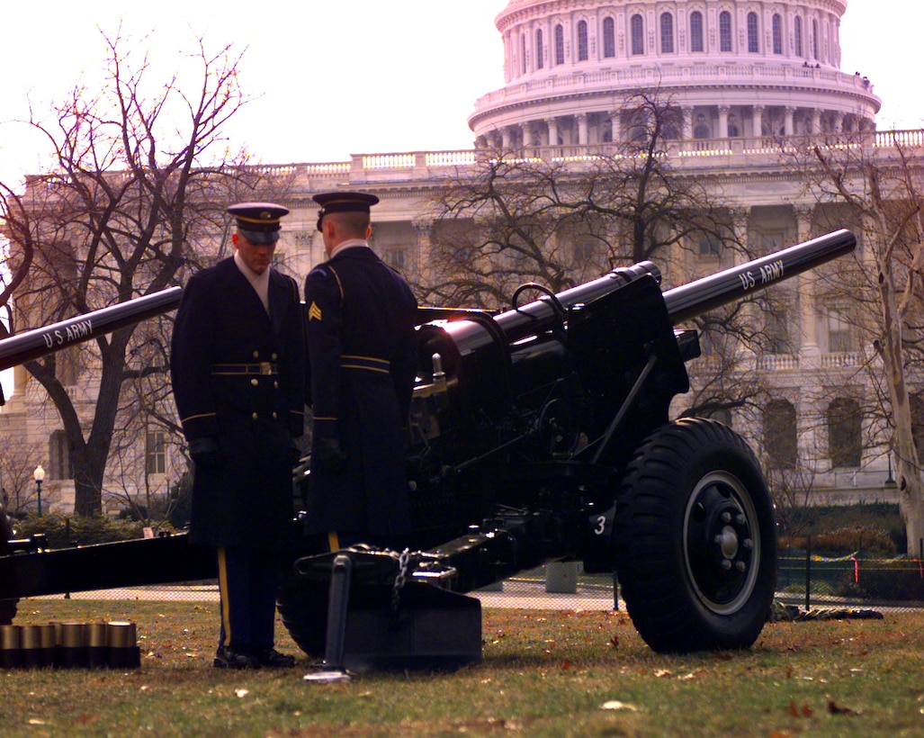Army 3rd U.S. Infantry Salute Guns Platoon members Sgt. Richard Lewi of Upper Marlboro, Md., and Spc. Stacy Nichols of Cleveland stand ready for a 21-gun salute to the president. Photo by Cpl. Joe Battista, USMC. 