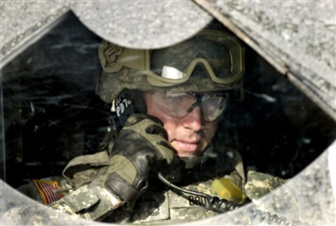 U.S. Army Sgt. 1st Class James Brown conducts a radio check during a simulated convoy attack as a part of mobilization training given by 1st Army Division Public Affairs at Fort Dix, N.J., on May 3, 2007.  Brown is assigned to the 131st Mobile Public Affairs Detachment.  