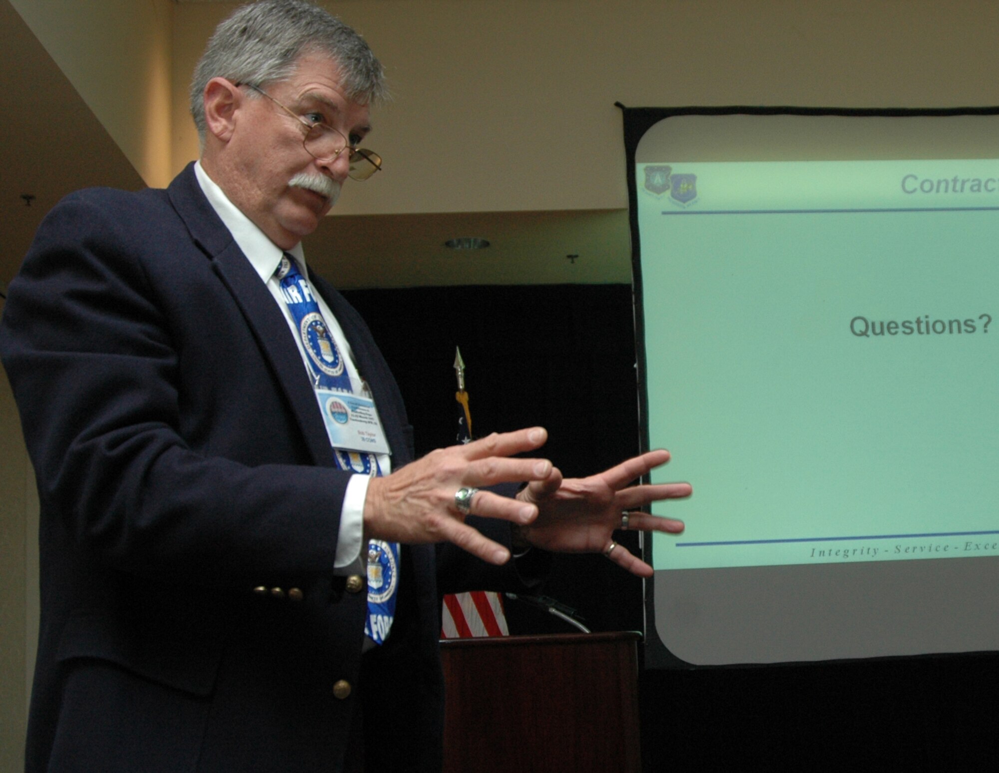 Bob Taylor, a 30th Contracting Squadron contracting specialist, answers questions about what contract types are used by Vandenberg Air Force Base and why during the small business conference at the Pacific Coast Club March 22. The small business conference "Opportunities Abound" was an outreach to small businesses with or in search of contracts with the base or the Air Force. The conference gave them an opportunity to network, gather information and promote products and services, to benefit from Vandenberg's objective to support small business. (Photo by Senior Airman Stephen Cadette) 