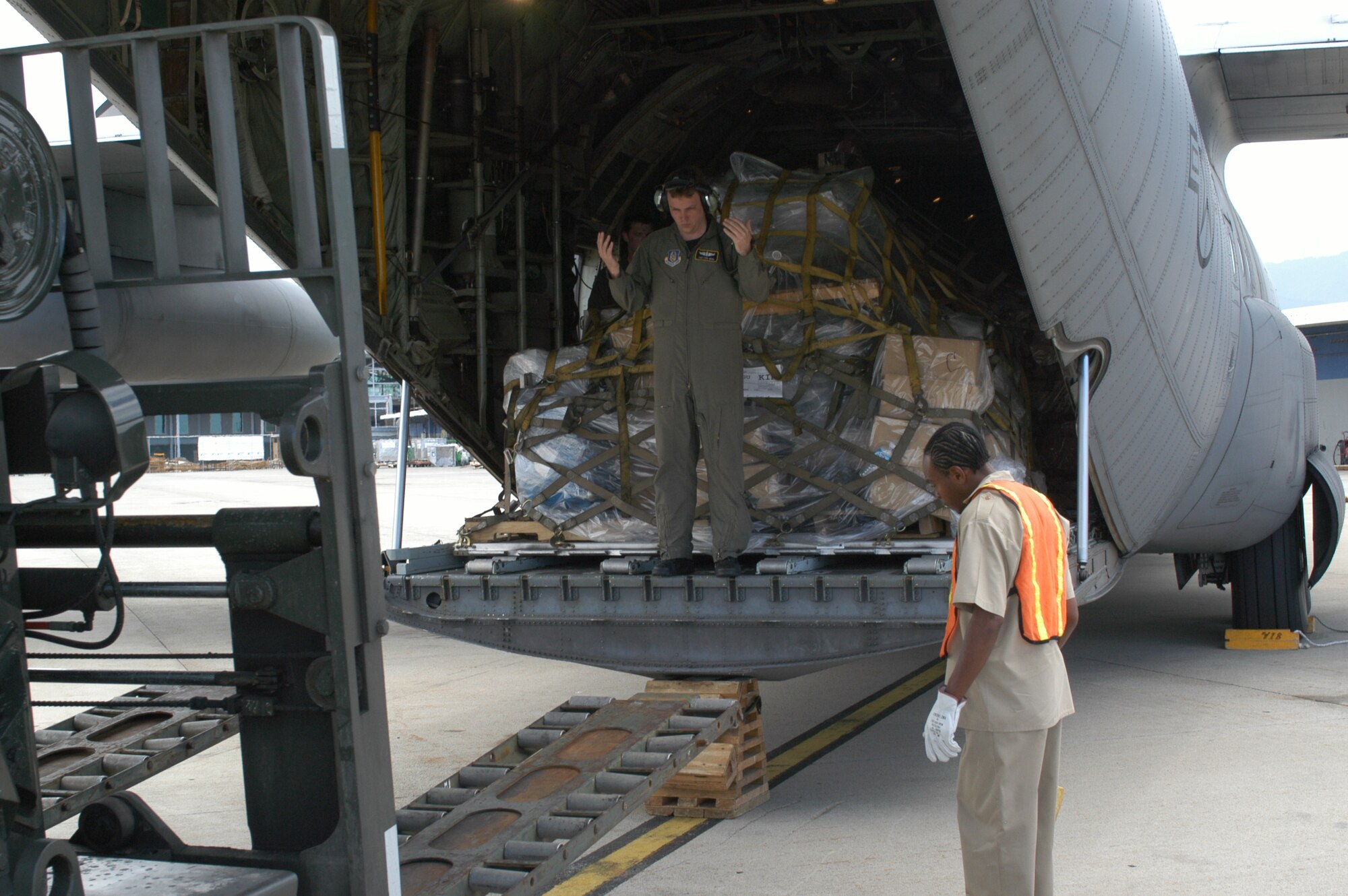 Tech. Sgt. Eric J Hebb, 758th Operations Group Loadmaster, and Norman Manley, a Jamaica International Airport employee, unload more than 12,000 pounds of medical supplies in Jamaica April 22. The medical supplies were donated by Children’s Medical Services International to the Cornwall Regional Hospital in Montego Bay, Jamaica and airlifted by the 911th Airlift Wing as part of the Denton Program. This program allows aid to be transfered by military equipment at no cost, if the airlift coincides with a scheduled training mission.  