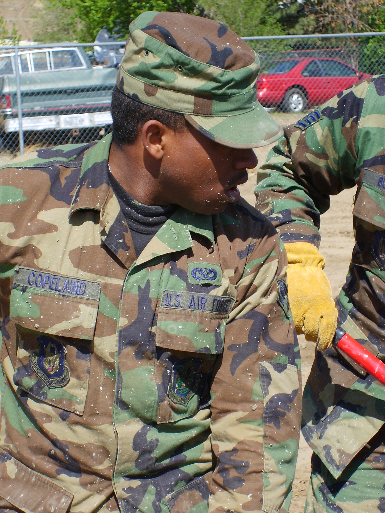 CARSON CITY, Nev. -- Senior Airman Travis Copeland is splattered with cement while helping prepare footings for a new structure at the Washoe Indian Tribe biulding site. Airman Copeland is one of 24 members of the 94th Civil Engineer Squadron from Dobbins Air Reserve Base, Ga., who performed their annual tour at Carson City as part of the Department of Defense's Innovative Readiness Training program. Every two weeks a new CE unit rotates through this site to complete civil engineering projects for the Washoe Tribe. Similar training takes place at several sites throughout the U.S. each year. (U.S. Air Force photo/Phil Rhodes)