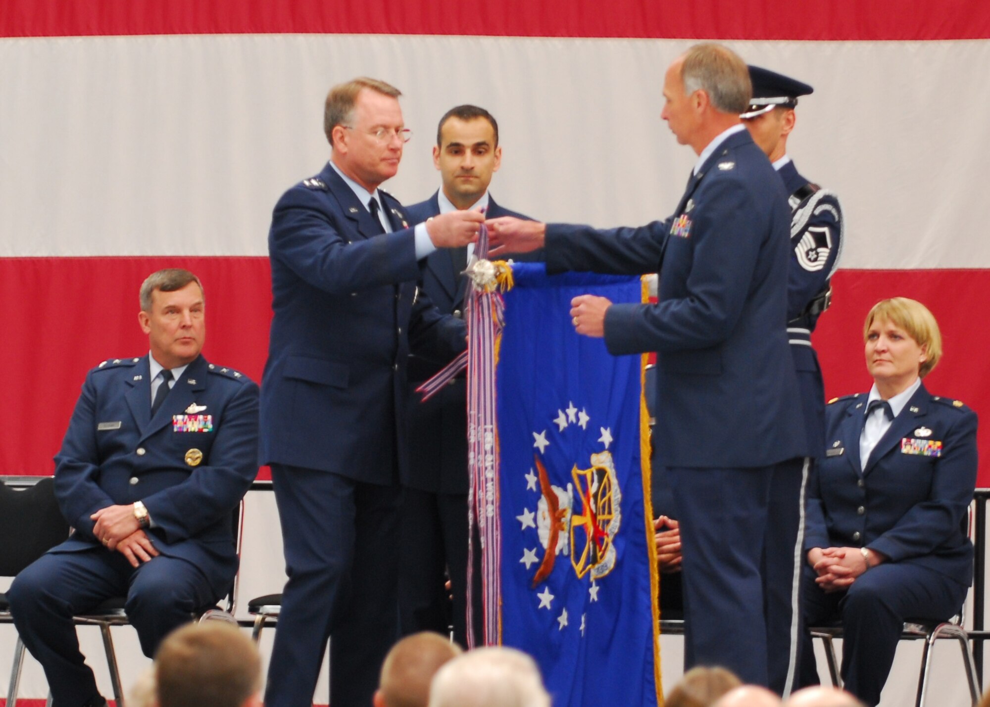 Lt. Gen. John Bradley, commander of the Air Force Reserve, presents the streamer for the 2006 Air Force Outstanding Unit Award to Col. William N. Flanigan, 939th Air Refueling Wing commander May 6, 2007.  Colonel Flanigan added the streamer to the wing's flag.  It was the sixth time the unit has received such an honor.  (U.S. Air Force photo/Senior Master Sgt. P.T. Barnum II) 