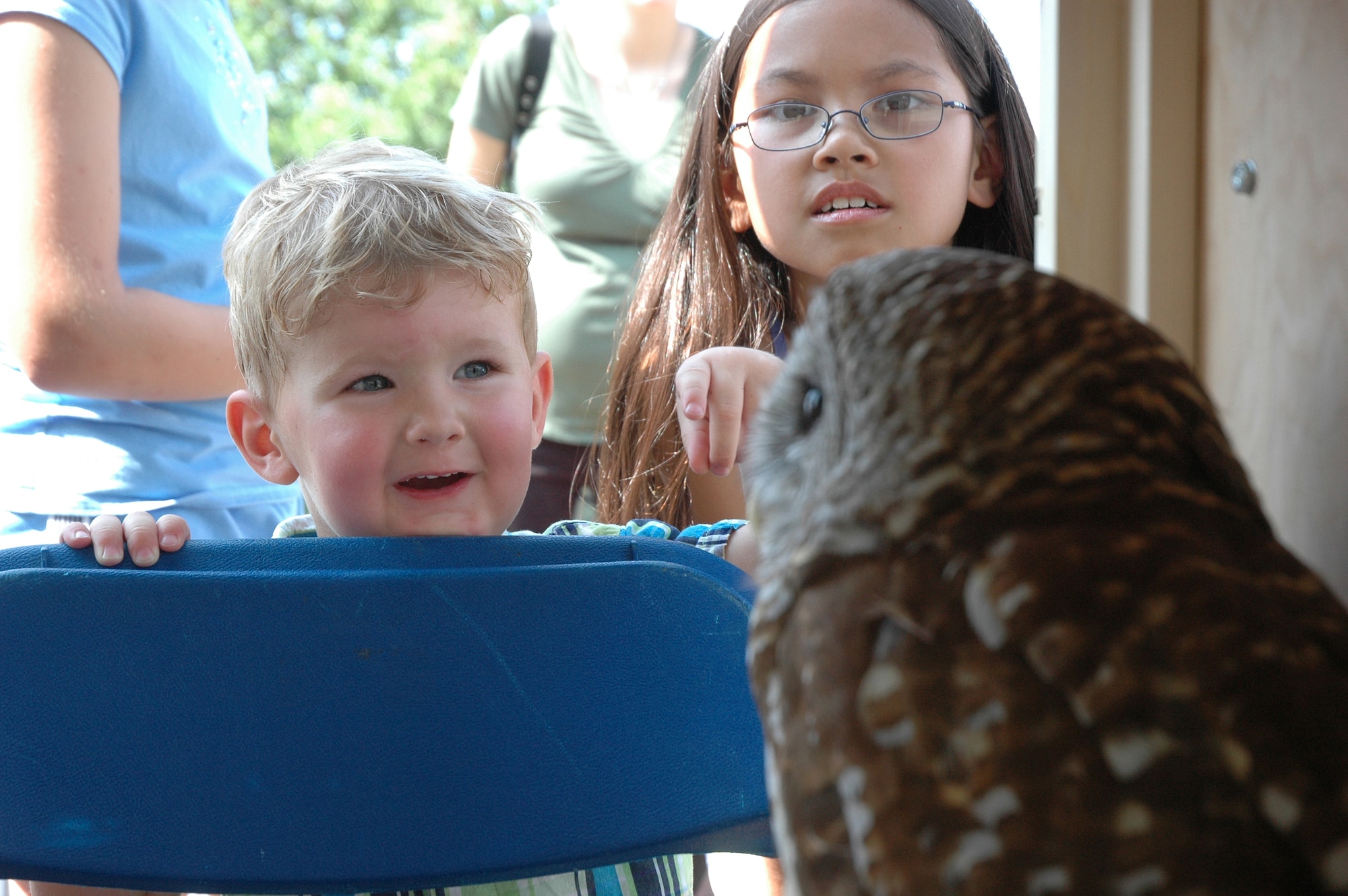 EGLIN AIR FORCE BASE, Fla. -- Michael Garden, 2, and Alesha Fairchild, 8, admire April, a barn owl and educational animal brought to Eglin's annual Pet Bazaar by the Emerald Coast Wildlife Refuge May 5. The event is sponsored for pet owners and offered a pet show, vendors, a military working dog demonstration and visits by McGruff the Crime Dog and Sparky the Fire Dog. (U.S. Air Force photo by Staff Sgt. Mike Meares)