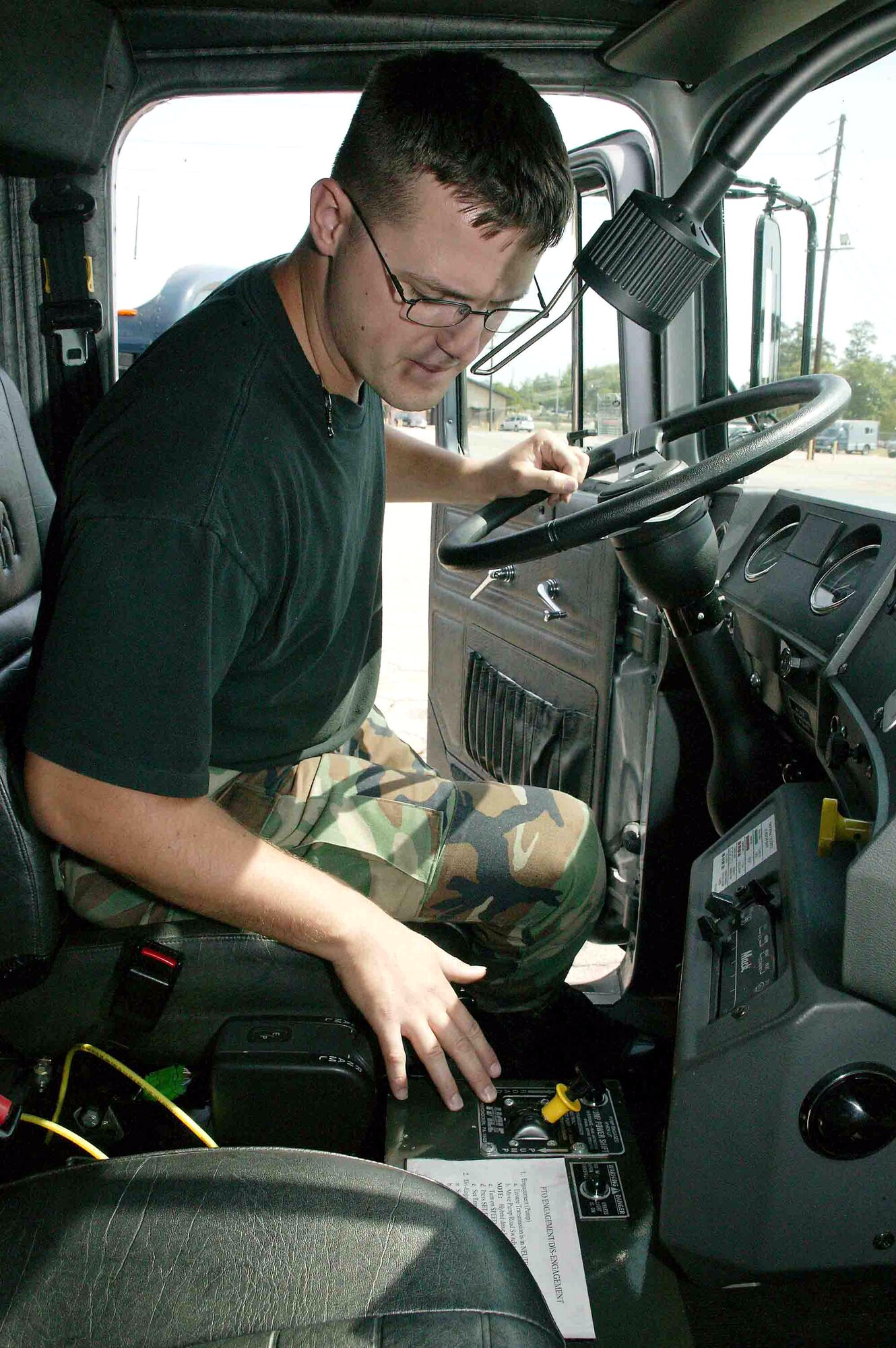 Staff Sgt. Stephen Zuelke inspects the interior electrical equipment of an R-11 hybrid refueling truck April 25 at Shaw Air Force Base, S.C. The environmentally-friendly hybrid is the only one of its kind in the Air Force. The 72,000-pound hybrid is undergoing a one-year test at Shaw to see how much money it saves on fuel, maintenance and other cost measurements. Sergeant Zuelke is a vehicle technician with the 20th Logistics Readiness Squadron. (U.S. Air Force photo/Senior Airman John Gordinier)