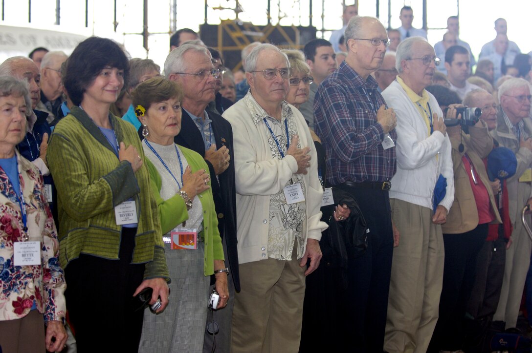 AFEES members stand during the National Antherm and colors presentation as the ceremony honoring their service begins, May 4. (Photo by Staff. Sgt. Tony Tolley)