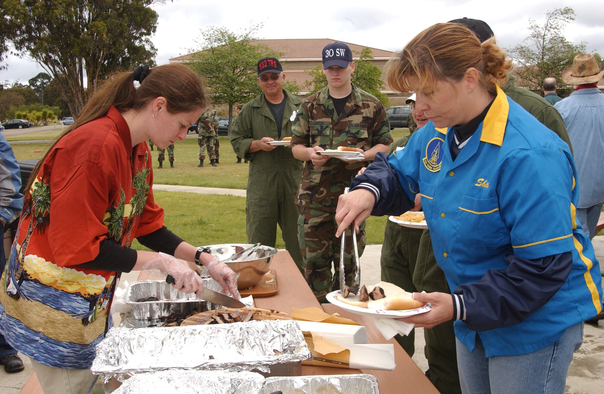 Airmen and their families feed on Santa Maria-style barbecue during the 392nd Training Squadron Combat Bocce Ball Tournament here May 4. The event was put on as one of the 381st TRG quarterly events to ensure morale stays high. (U.S. Air Force Photo by Nichelle Griffiths)