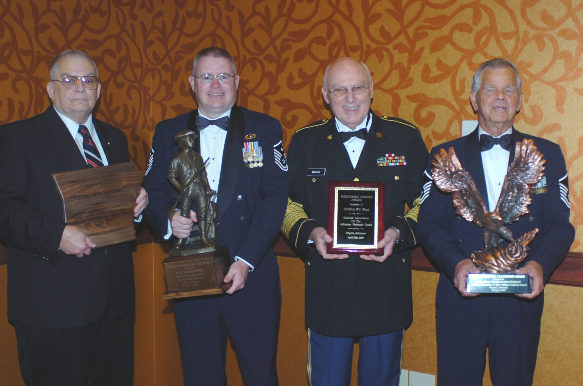 (From left) Retired Army Guard Warrant Officer John Heffernan, Master Sgt. Bob Oldham, retired Army Guard 1st Sgt. W.C. Wood and retired Air Guard Master Sgt. Charlie Hagerman with their Enlisted Association of the Arkansas National Guard awards. (U.S. Air Force photo by Maj. Keith Moore)