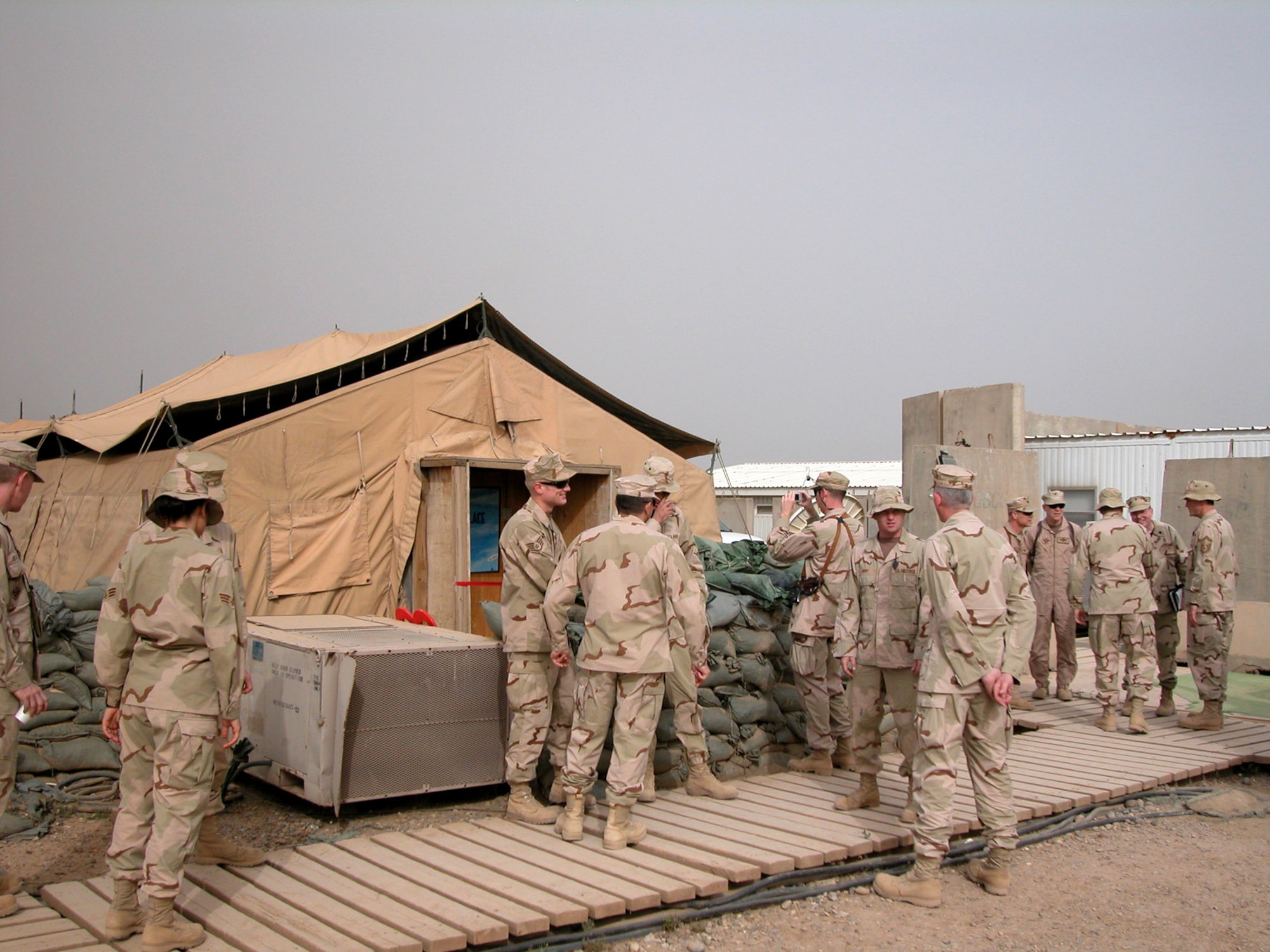 Airmen gather for the May 4 grand opening of Troy's Place, a Airmen's Ministry Center at Balad Air Base, Iraq. The center is named in honor of Maj. Troy Gilbert, an F-16 Fighting Falcon pilot from Luke Air Force Base, Ariz., deployed to Balad AB, who died supporting U.S. ground forces pinned down by Anti-Iraqi forces Nov. 27, 2006. (U.S. Air Force photo/Master Sgt. Bryan Ripple) 
