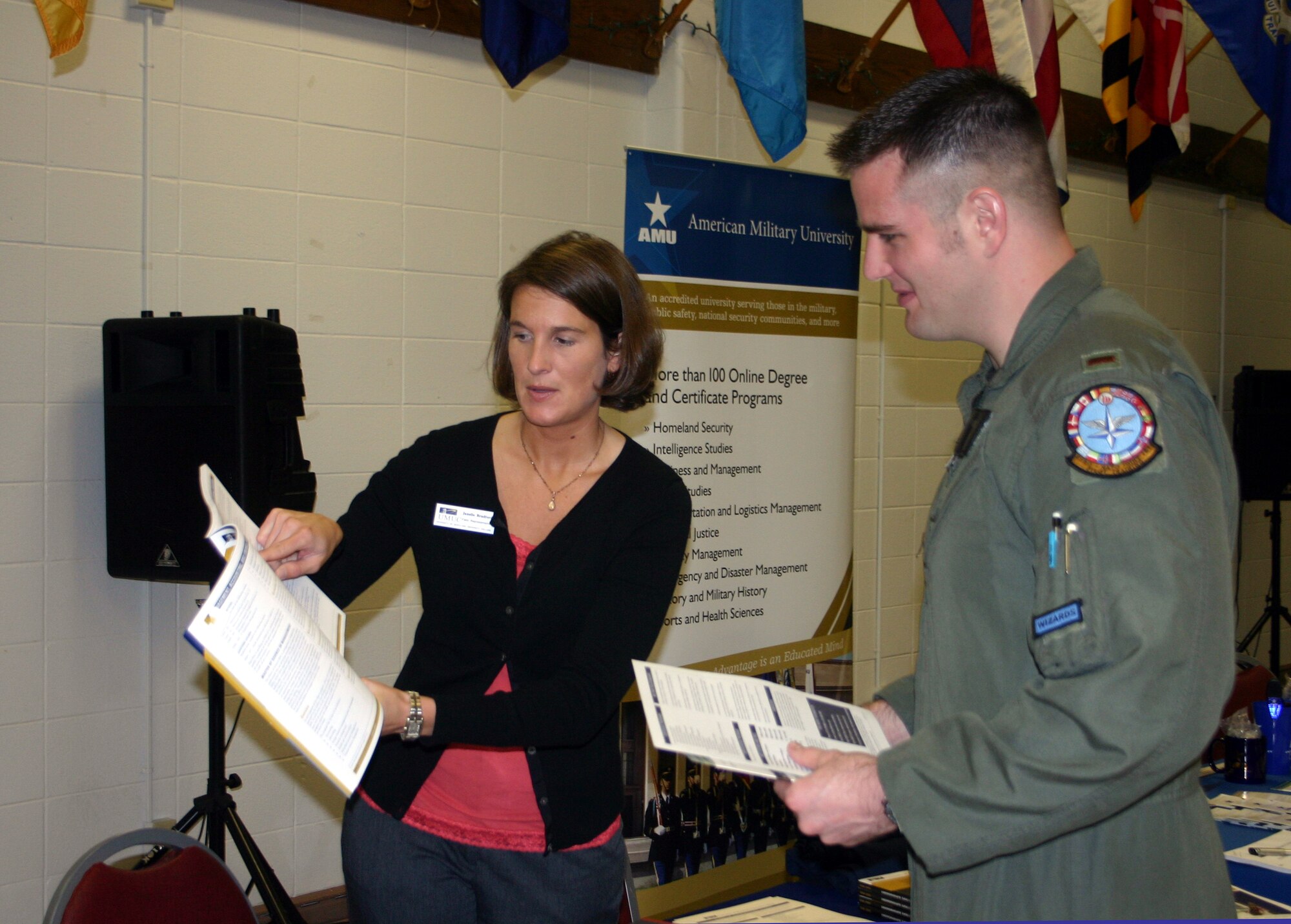 2nd Lt. Damian Ash, a student pilot with the 80th Operations Support Squadron, talks to Janelle Bradford, University of Maryland University College, May 7 at the Sheppard Education Fair. (U.S. Air Force photo/Airman 1st Class Jacob Corbin)