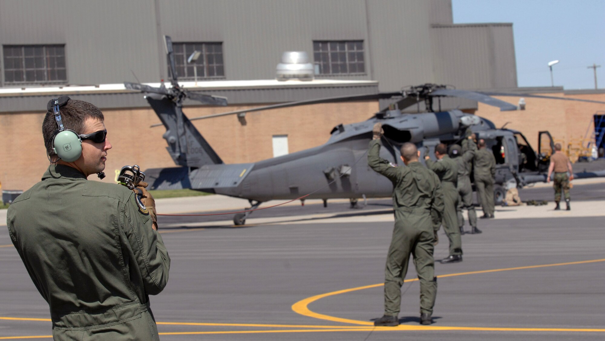 Staff Sgt. Greg White leads squadron members in an HH-60 Pave Hawk pre-flight hoist cable check May 3 during a combat search and rescue integration exercise in Sandy, Utah. The objective of the exercise was to expand expertise and integration with Utahs 211th Aviation Group AH-64 Apache Joint Rotary Wing, 4th Fighter Squadron F-16 Fighting Falcon Striker assets, Special Operations Forces and conduct extensive joint CSAR operations against surface-to-air threats. Sergeant White is an an aerial gunner with the 34th Weapons Squadron at  Nellis Air Force Base, Nev. (U.S. Air Force photo/Master Sgt. Kevin J. Gruenwald) 
