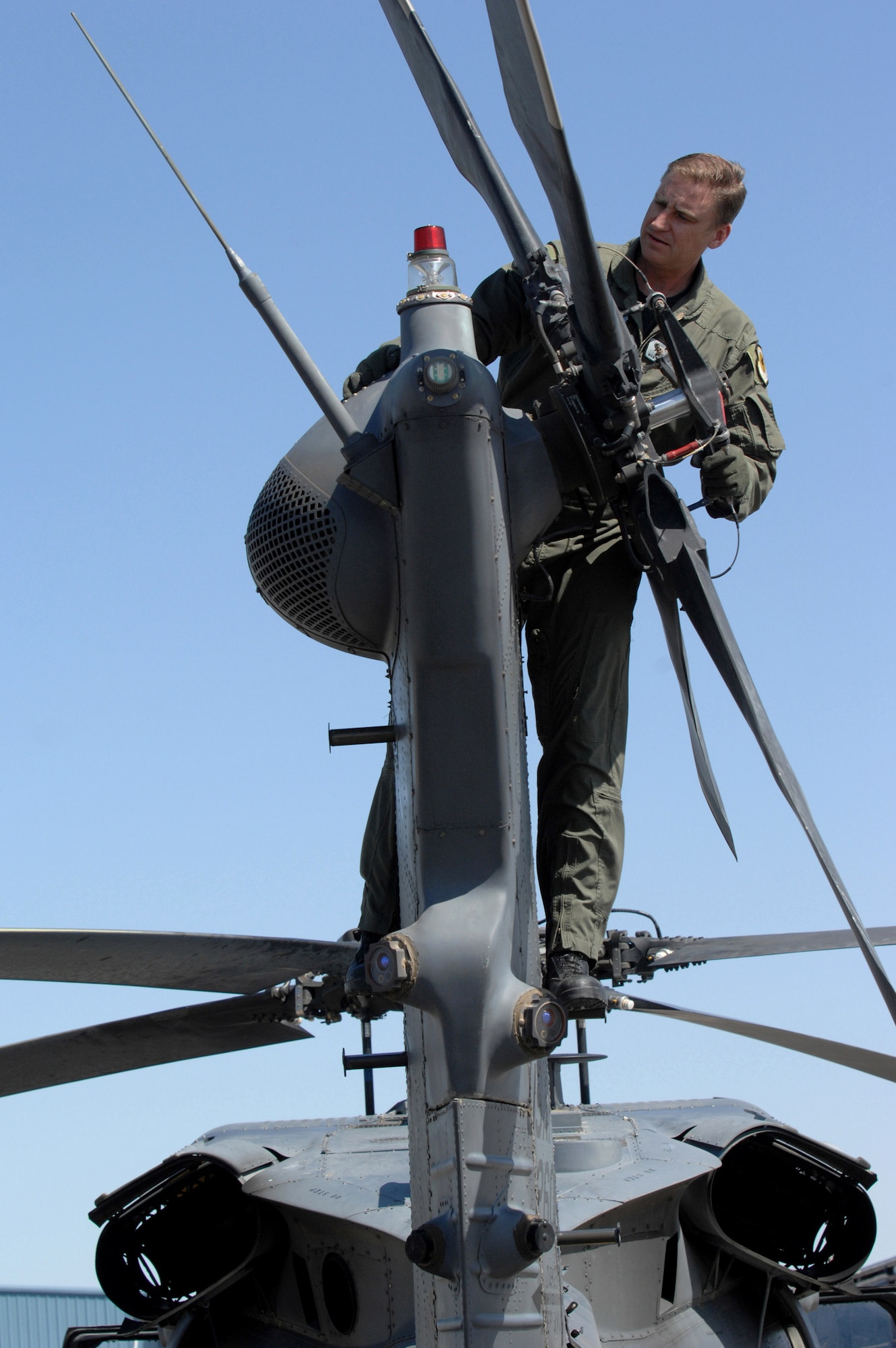 Master Sgt. Michael Harkins inspects an HH-60 Pave Hawk rotor tail assembly May 3 during a combat search and rescue integration exercise in Sandy, Utah. The objective of the exercise was to expand expertise and integration with Utah's 211th Aviation Group AH-64 Apache Joint Rotary Wing, 4th Fighter Squadron F-16 Fighting Falcon Striker assets, special operations forces and conduct extensive joint CSAR operations against surface to air threats. Sergeant Harkins is a flight engineer with the 34th Weapons Squadron at Nellis Air Force Base, Nev. (U.S. Air Force photo/Master Sgt. Kevin J. Gruenwald) 
