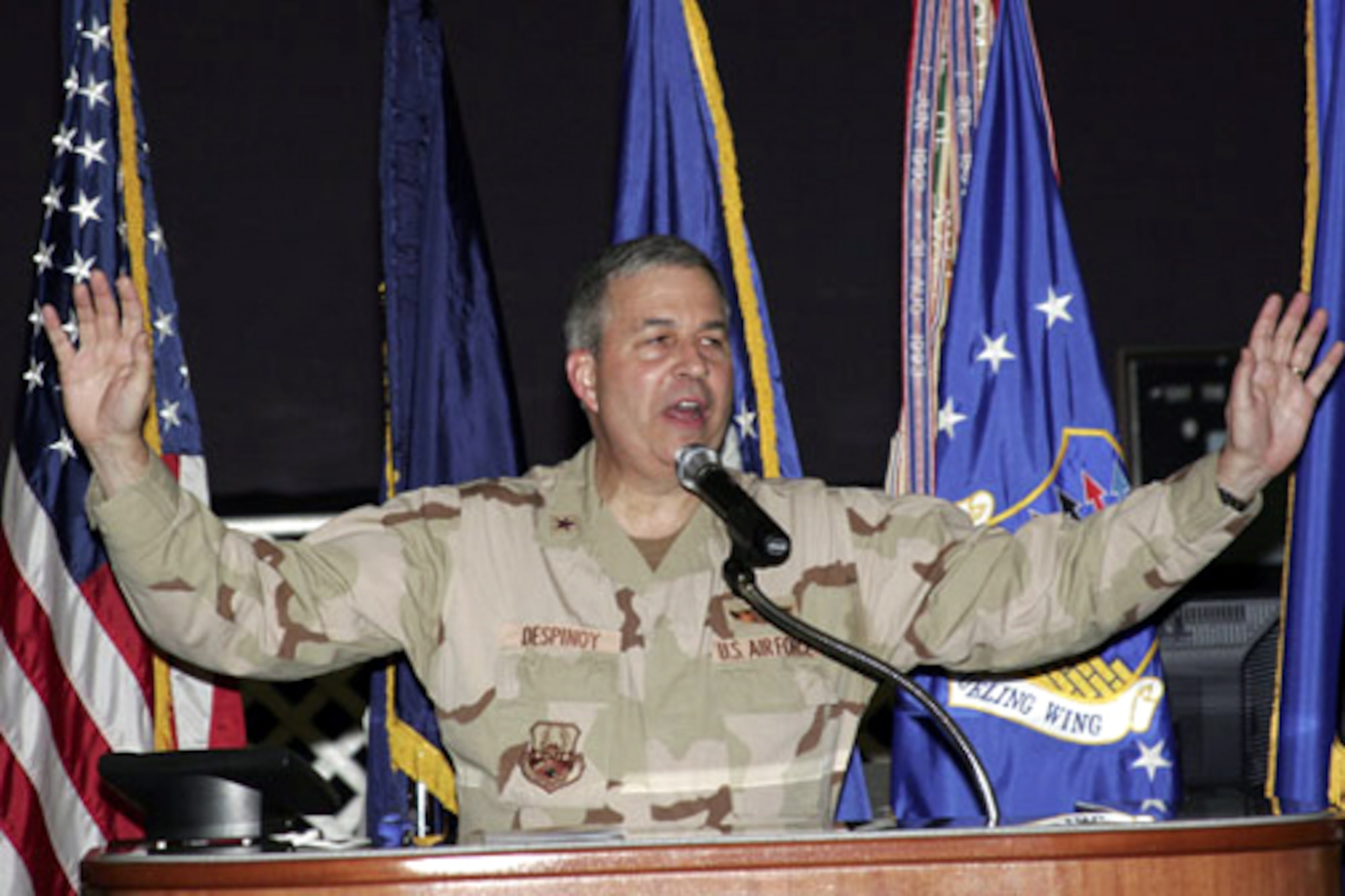 GRISSOM AIR RESERVE BASE, Ind., -- Brig. Gen. Dean Despinoy, 434th Air Refueling Wing commander, gestures as he makes a point while addressing the crowd at the first 'State of the Base' address. The event held May 4, brought both military and civilian members together for a special evening of entertainment and an address by the general on current activities at Grissom -- and the base's future. (Air Force Photo/Senior Airman Omar Delacruz)