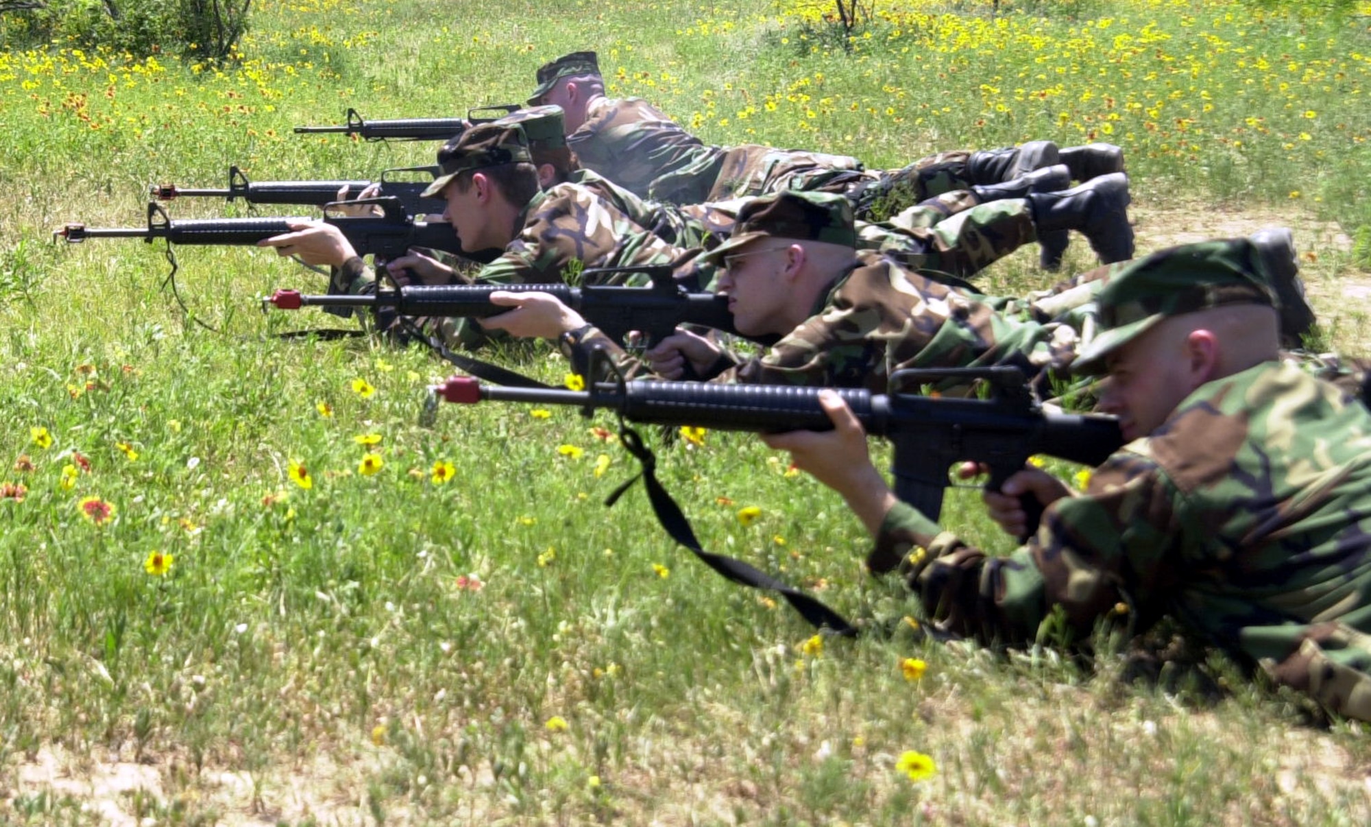 Cadets from Air Force Reserve Officer Training Corps Detachment 847 line up and fire M-16 rifles loaded with blank ammunition during the air base defense section of a field training exercise April 28 at Goodfellow Air Force Base, Texas. Instructors from the 17th Security Forces Squadron assisted the cadets with basic firearm safety and cleaning procedures. (U.S. Air Force photo by Airman 1st Class Stephen Musal)