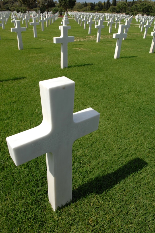 A grave marker for Army Staff Sgt. Donald E. Taylor, a 60th Infantry Regiment, 9th Infantry Division World War II casualty from Wisconsin who died Nov. 9, 1942, stands in the North Africa American Cemetery in Carthage, Tunisia, May 5, 2007. 