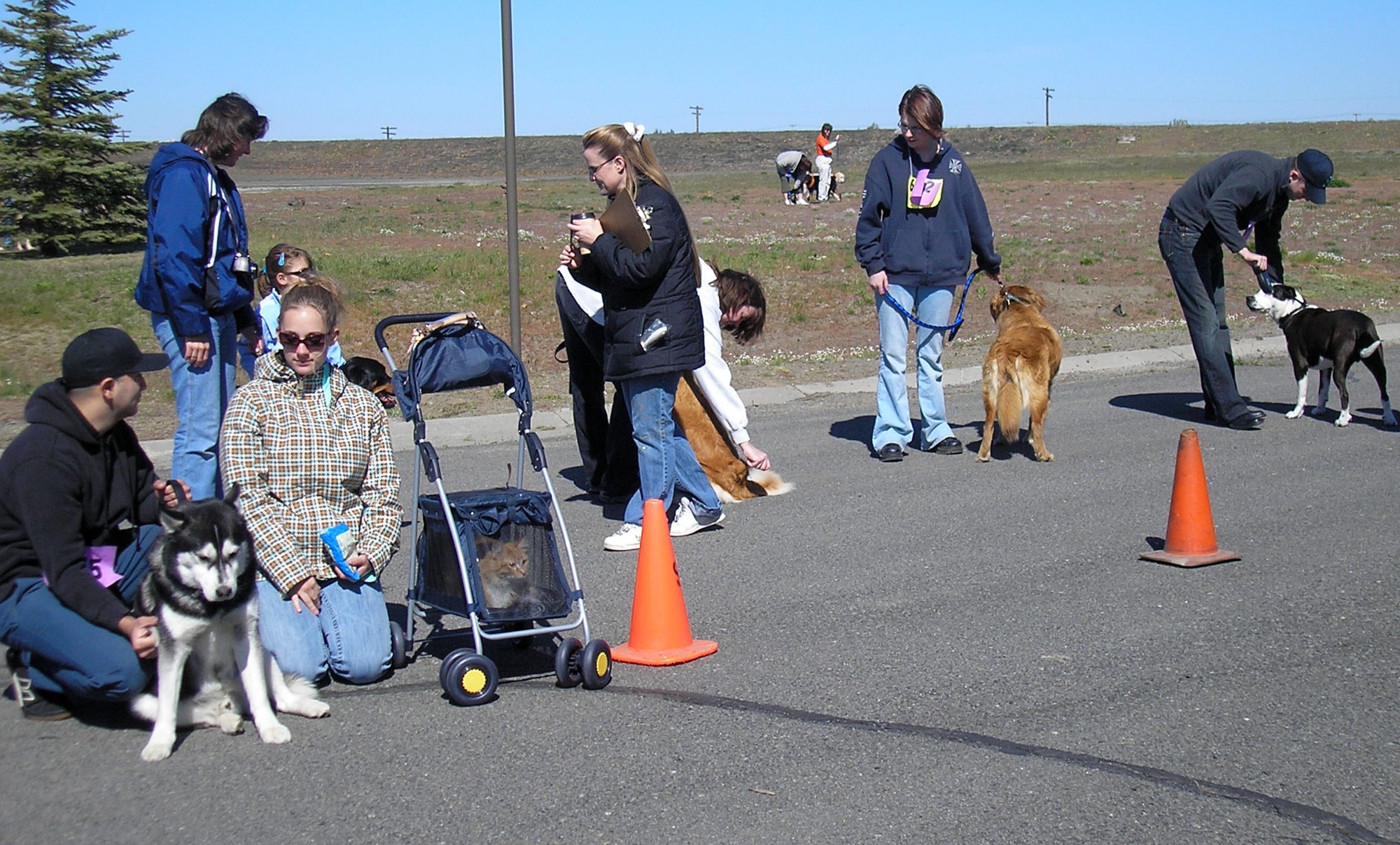 FAIRCHILD AIR FORCE BASE, Wash. – Owners of dogs in the canine 51-99 lbs category wait for their turn to show their animals at the Base Exchange pet show May 5. (Photo by Stephani Edington)
