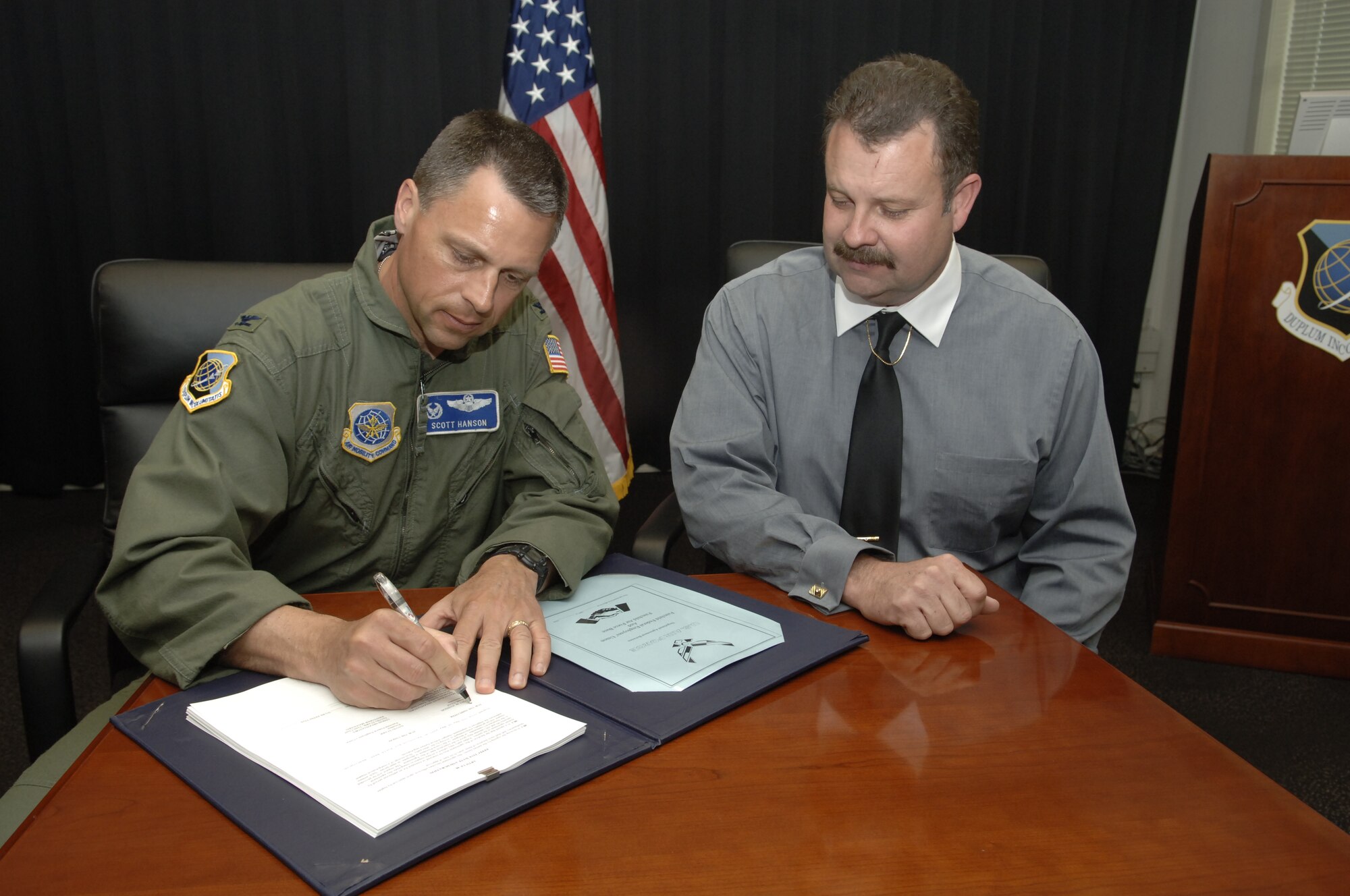 FAIRCHILD AIR FORCE BASE, Wash. – Col. Scott Hanson, 92nd Air Refueling Wing commander, and David Starr, Fairchild Federal Employees Union’s president, sign a new labor agreement May 7. If approved by DoD’s Civilian Personnel Management Service, the new labor agreement will be effective June 8. (U.S. Air Force photo/Senior Airman Chad Watkins)