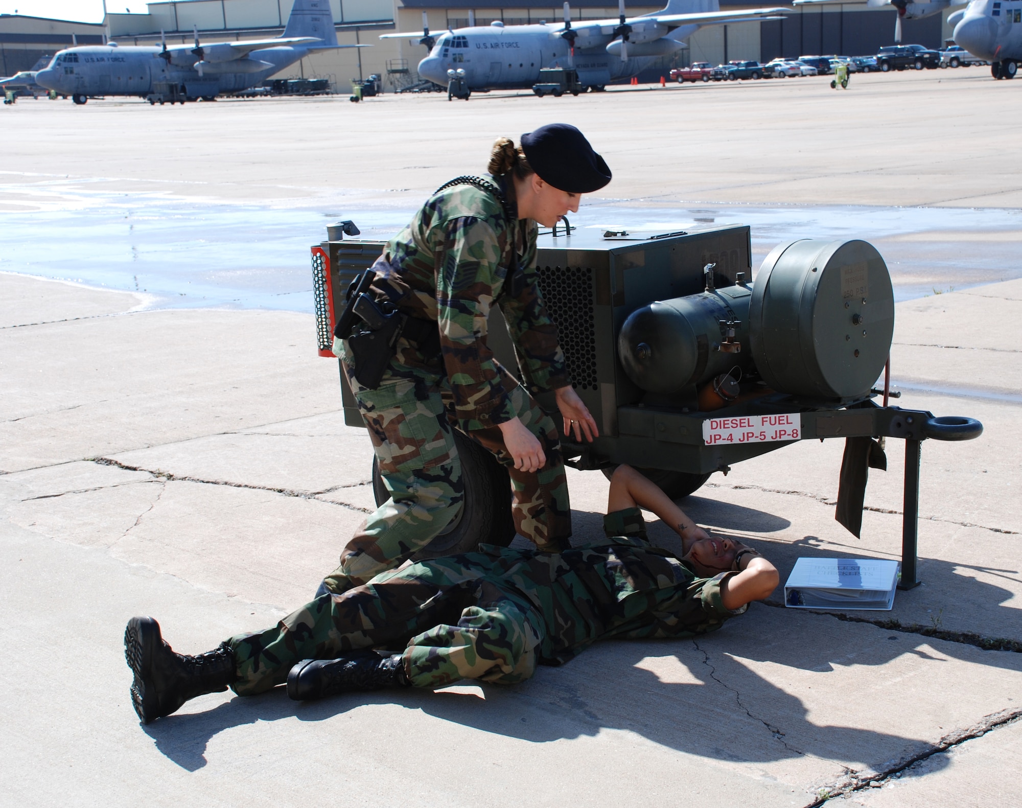 Tech. Sgt. Jacqueline Baumeyer, 82nd Security Forces Squadron, moves to help a downed Airman-in-Training during the Severe Weather Response Excercise May 3. (U.S. Air Force photo/Airman 1st Class Jacob Corbin)