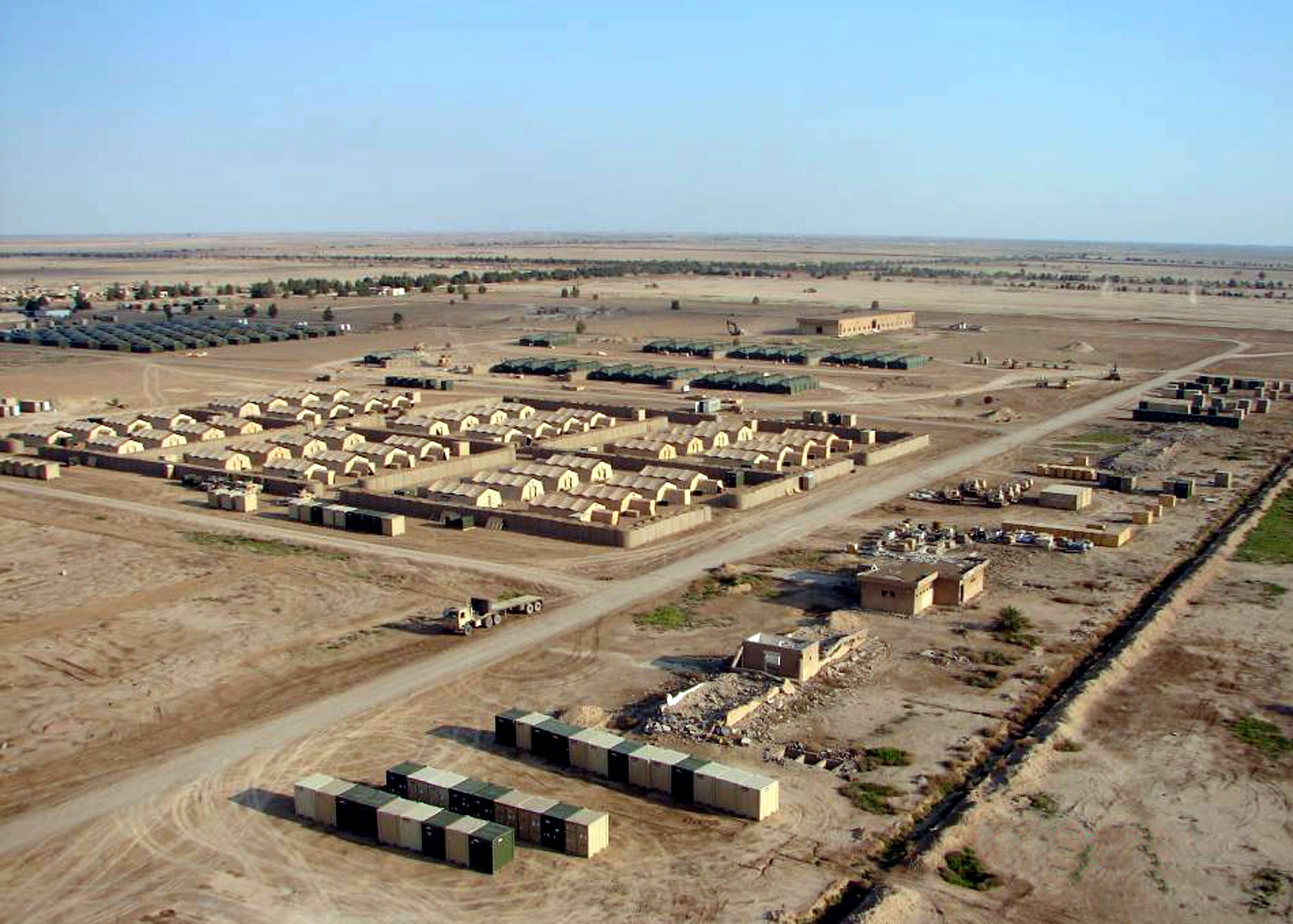 Pictured is an aerial view of Forward Operating Base Hammer, Iraq. Airmen from the 557th Expeditionary RED HORSE Squadron and Soldiers from the 92nd Engineer Battalion's "Black Diamonds" have completed Phases 1 and 2 of the multi-part Besmaya project to bed down the Army's 3rd Brigade Combat Team, 3rd Infantry Division, from Fort Stewart, Ga., in support of the Baghdad Security Plan. (U.S. Air Force photo) 