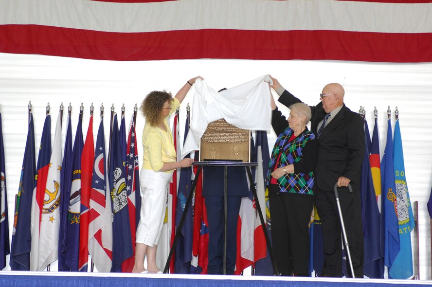 MINOT AIR FORCE BASE, N.D. -- A newly refurbished facility was dedicated the Patterson Maintenance Facility in honor of Lt. Col. David R. Patterson during a dedication ceremony here May 4. During the ceremony, Colonel Patterson's wife, Sheree, and his parents, Malcolm (Pat) and Jean, unveiled the new facility plaque, which concludes with the words: "He believed in the 5th Bomb Wing maintainers and marveled at their everyday Herculean efforts. He was a true American patriot and friend to all." Prior to his accidental death Sept. 18, 2004, Colonel Patterson was the 5th Maintenance Group deputy commander. (U.S. Air Force photo by Airman 1st Class Joe Rivera)