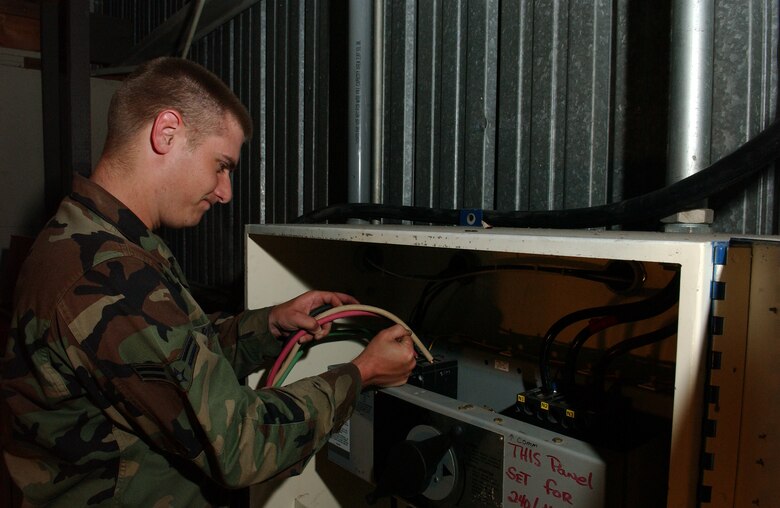 Airman 1st Class Anthony Richmond connects a generator to the power production building on Vandenberg AFB May 7. The power production journeyman with the 30th Civil Engineer Squadron maintains the machines that generate auxiliary power during a commercial power outage. (U.S. Air Force photo by Staff Sgt. DeNoris Mickle)