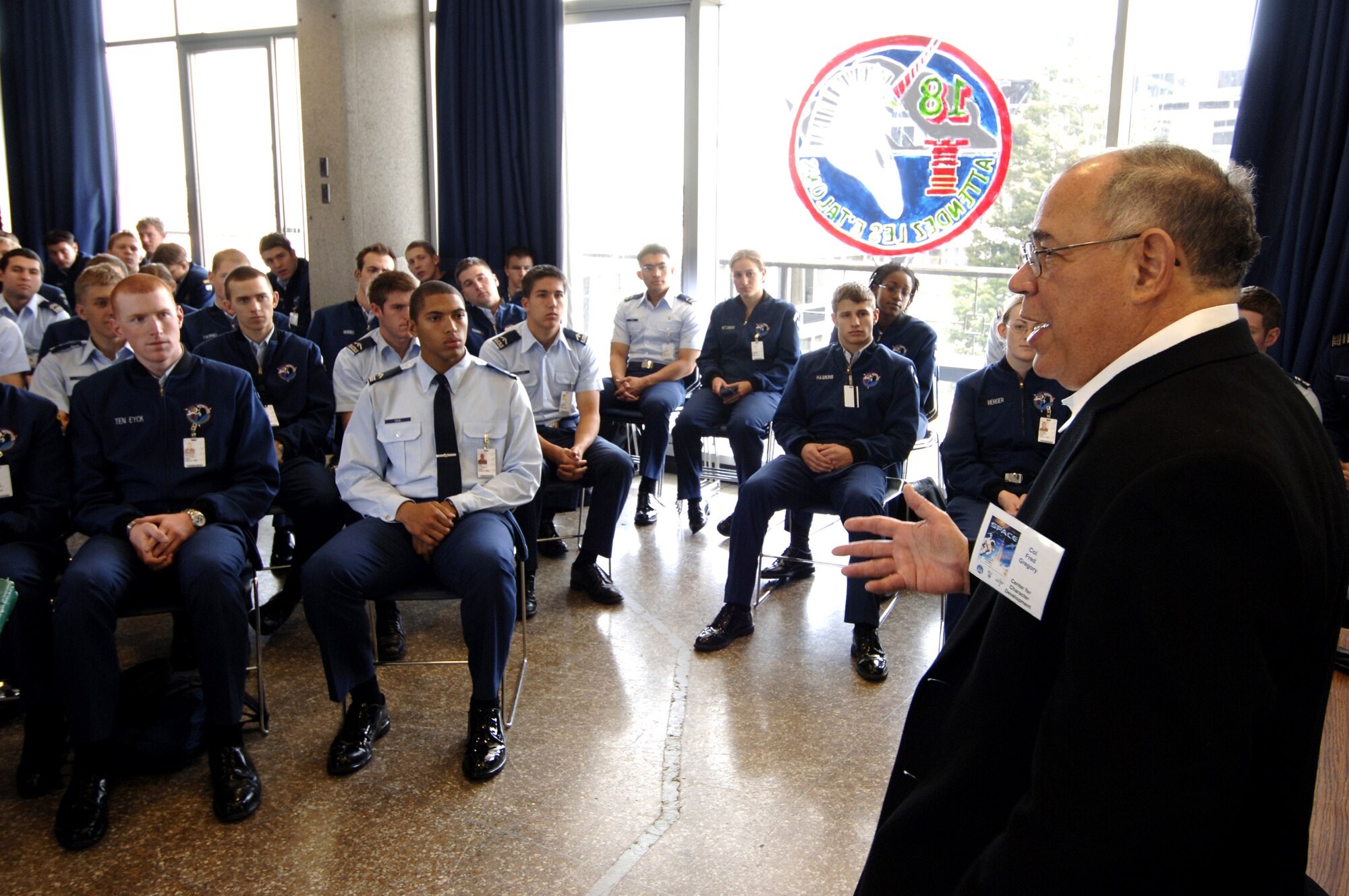 Retired Col. Fred Gregory speaks to Cadet Squadron 18 members during their lunch period in April at the academy. Colonel Gregory, a 1964 academy graduate, is also a veteran of three space shuttle missions, logging more than 455 hours in space. The colonel also logged more than 6,976 hours flying time in more than 50 types of aircraft -- including 550 combat missions in Vietnam. (U.S. Air Force photo/Mike Kaplan) 
