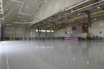 MINOT AIR FORCE BASE, N.D. -- A newly refurbished facility was dedicated the Patterson Maintenance Facility in honor of Lt. Col. David R. Patterson during a dedication ceremony here May 4. Prior to his accidental death Sept. 18, 2004, Colonel Patterson was the 5th Maintenance Group deputy commander. The facility plaque includes the words: “He believed in the 5th Bomb Wing maintainers and marveled at their everyday Herculean efforts.” The $9.2-million multi-use facility is capable of fully housing a B-52H, a critical capability at a base known for its cold-weather temperatures. (U.S. Air Force photo by Airman 1st Class Joe Rivera)