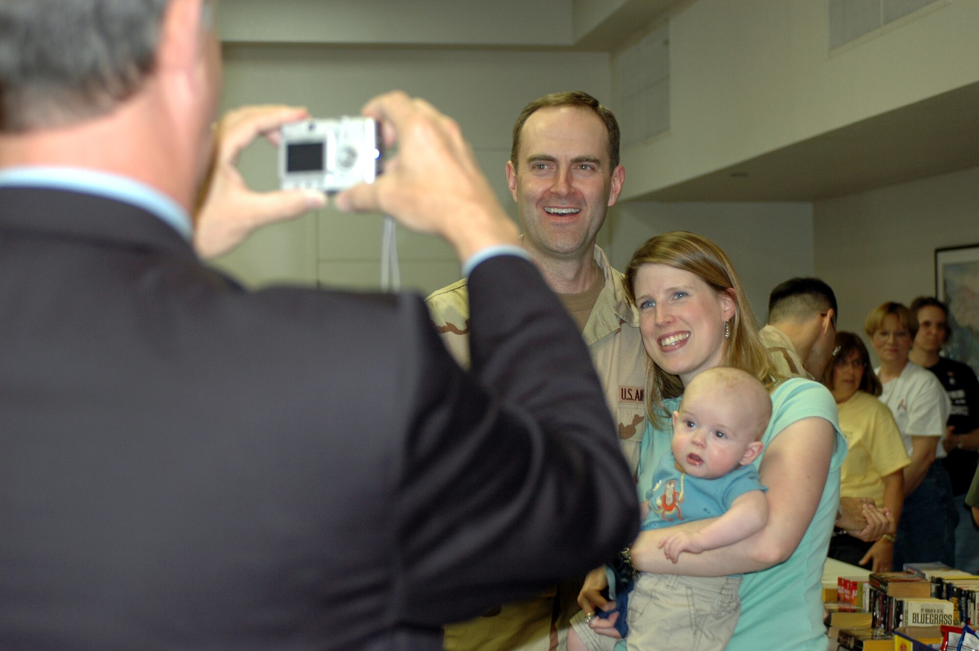 Maj. Brian Wyrick, 60th Medical Support Squadron, and his family pose for a picture at the Travis Passenger Terminal May 5. More than 60 Team Travis members deployed as part of part of Air Expeditionary Force-cycles 7/8. (U.S. Air Force photo by Staff Sgt. Candy Knight) 