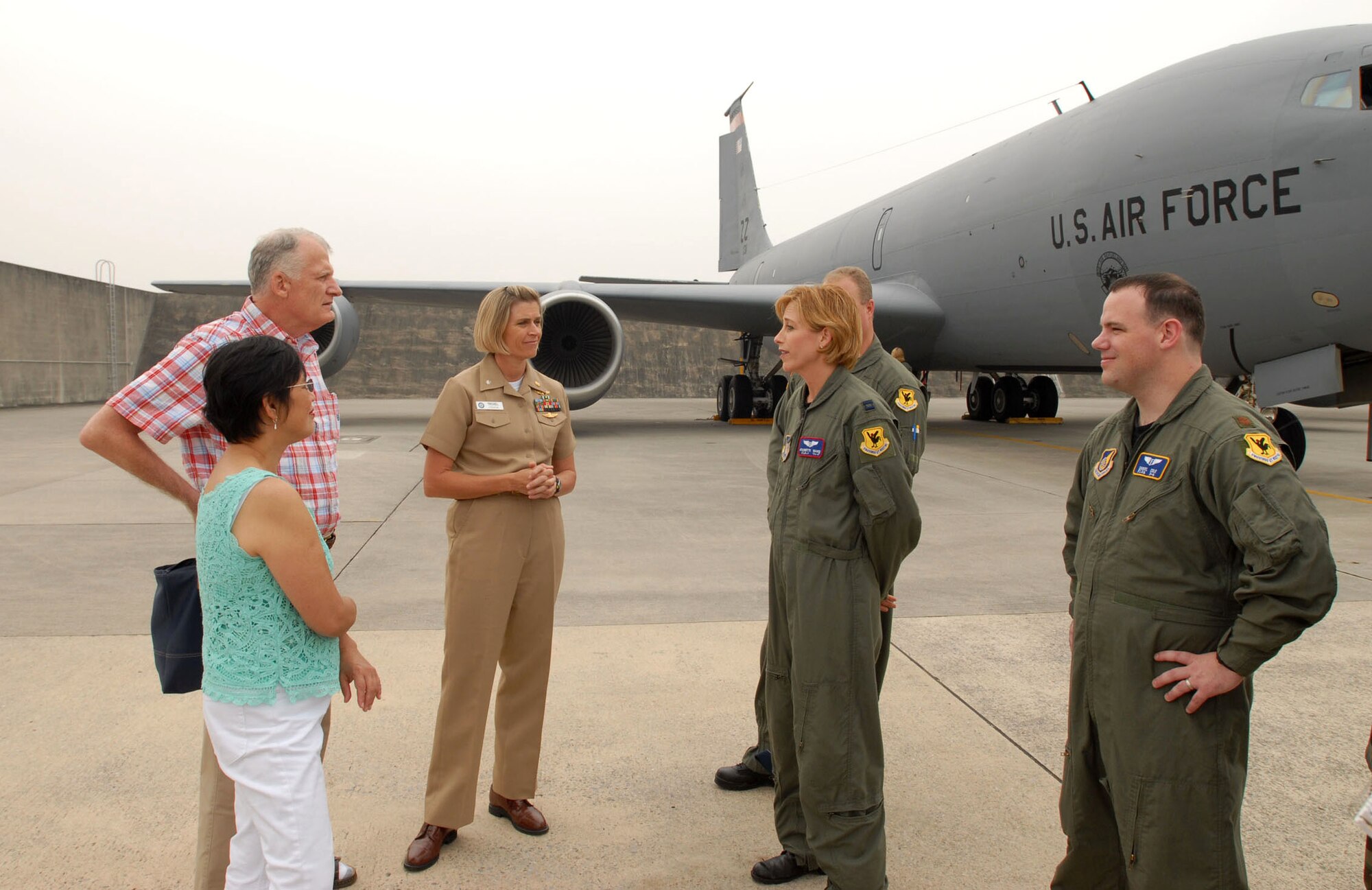 Capt. Jeannette Ward (second from right) talks with Jim and Marite Brierly while Navy Cmdr. (Dr.) Sharon Troxel and Maj. (Dr.) Dan Cole look on May 2 at Kadena Air Base, Japan. Commander Troxel, Major Cole and Captain Ward were part of the team that treated and medically evacuated Mr. Brierly to Hawaii after he suffered a major heart attack March 30, 2006. Mr. and Mrs. Brierly visited the units to thank them for their efforts. Mr. Brierly is a English as a second language teacher at Kadena Elementary School here. Commander Troxel is the head of the emergency department at U.S. Navy Hospital-Okinawa. Major Cole is the 18th Medical Operations Squadron medical services flight commander and a critical care medical attendant team staff physician for pulmonary and critical care. Captain Ward is a flight nurse with the 18th Aeromedical Evacuation Squadron. (U.S. Air Force photo/Airman 1st Class Kasey Zickmund)