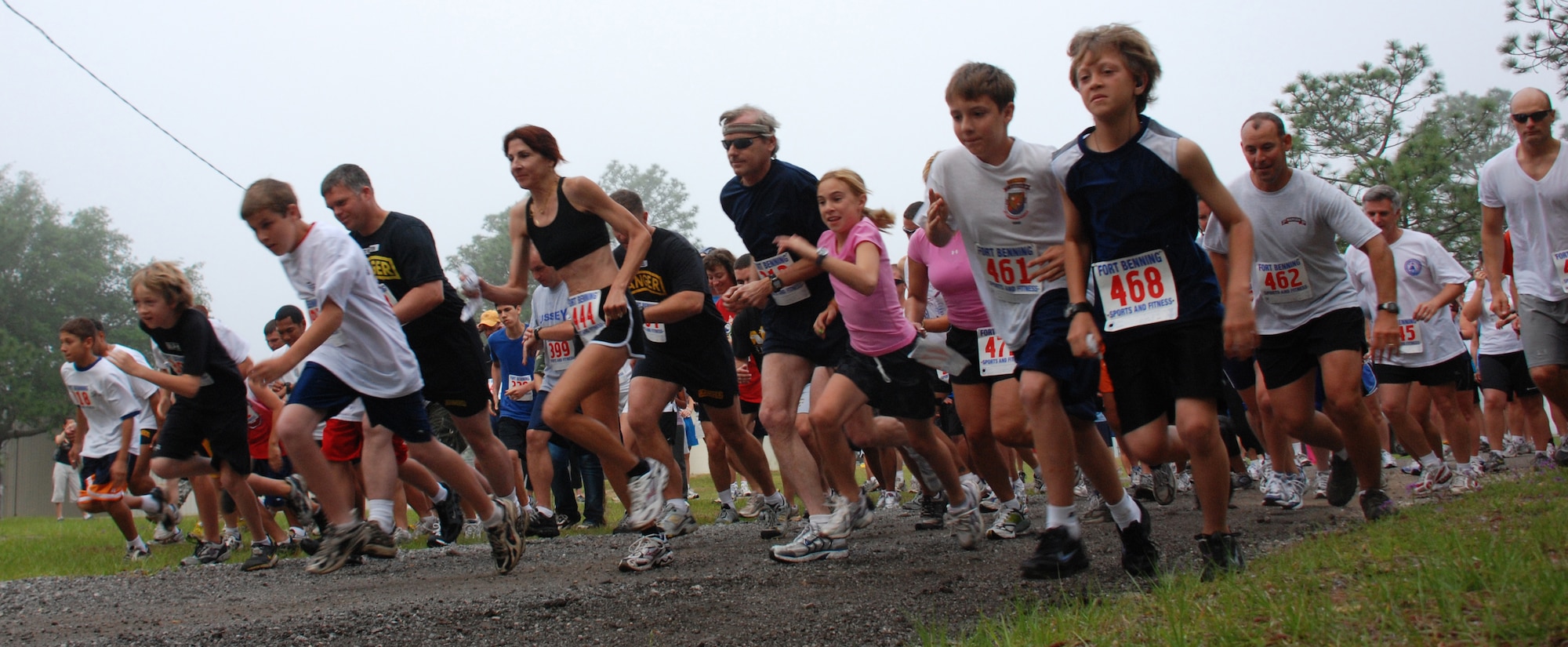 CAMP RUDDER, Fla. -- A group of more than 250 runners take off during the first of an annually planned five-kilometer and 10-kilometer run at the 6th Ranger Training Battalion Ranger Open House May 6. More than $4,000 raised from the race and the Open House were donated to the Fisher House. "A largest crowd ever" of people of all ages visited the 6th RTB Rangers as they brought out their equipment for hands-on displays of weapons, diving equipment, Zodiac boat, parachute, medical and a day-in-the-life display for the Ranger training school. (U.S. Air Force photo by Staff Sgt. Mike Meares)