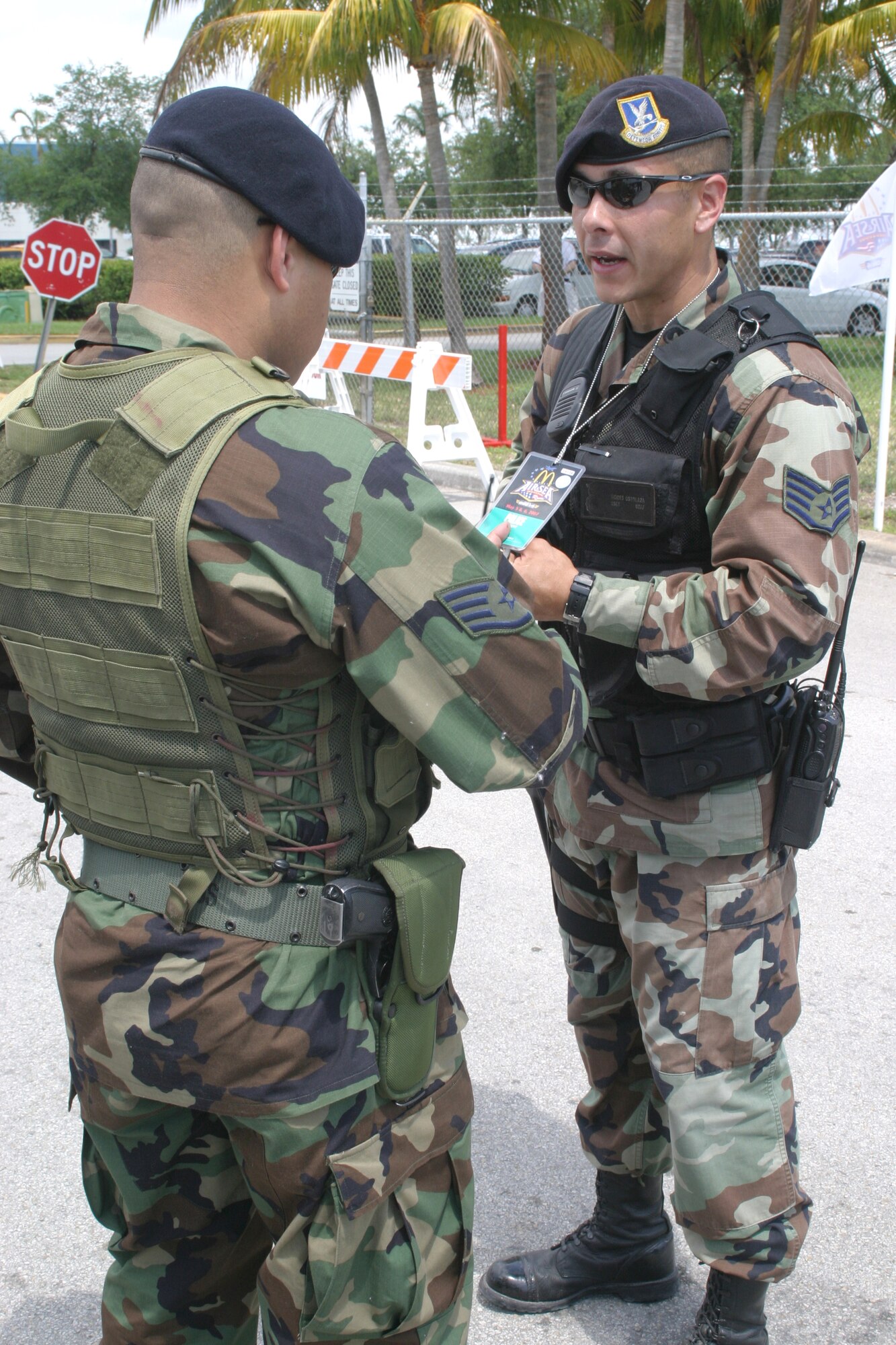 Staff Sgts. Moises Ostolaza (right) and Hector Santana review security credentialing requirements at an Opa Locka entry control point during the 2007 McDonald’s Air and Sea Show in Ft. Lauderdale, Fla..  The sergeants are from Air Force Reserve Command’s 482nd Fighter Wing at Homestead Air Reserve Base, Fla., and their teams provided security for all aircraft during the four-day event which attracted more than two million visitors. (U.S. Air Force photo/Tech. Sgt. Paul Dean)