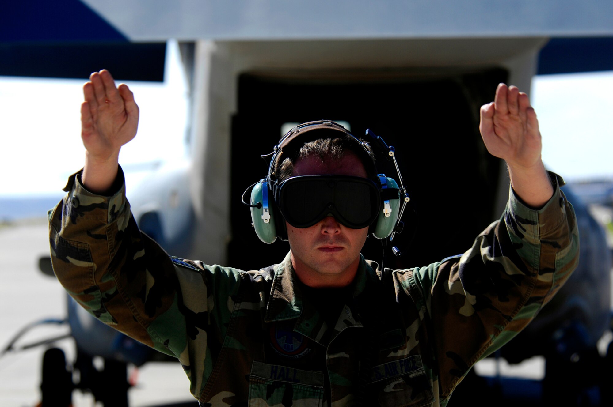 Marshalling out an Osprey, Hall takes his duties as a CV-22 crew chief seriously and, like the rest of his maintenance unit, gives the performance and safety of the tiltrotor aircraft an enthusiastic thumbs up. (Photo by Tech. Sgt. Matthew Hannen)