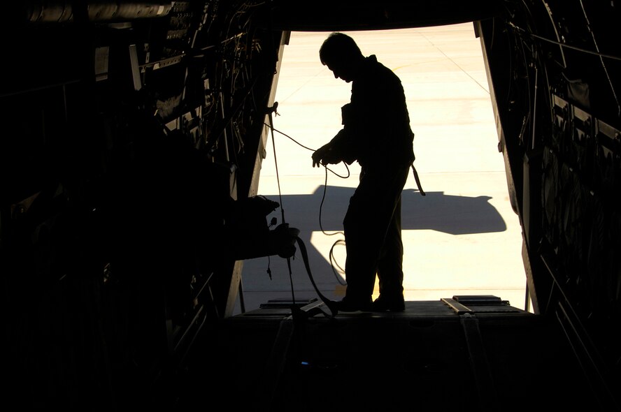 Preparing for a training mission at Kirtland, Master Sgt. Jim Hessick, a CV-22 flight engineer for the 71st Special Operations Squadron, gives the tiltrotor aircraft a thorough look-over before takeoff. (Photo by Tech. Sgt. Matthew Hannen)
