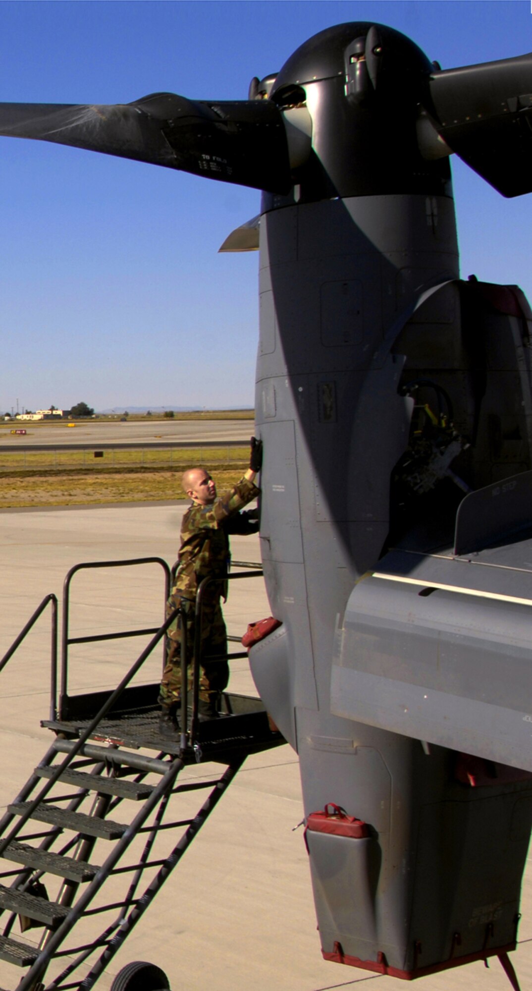 CV-22 Osprey Crew Chief Staff Sgt. Greg Dove of the 71st Aircraft Maintenance Unit performs maintenance on the Air Force's newest tiltrotor aircraft to prepare for a mission at Kirtland AFB, N.M. (Photo by Tech. Sgt. Matthew Hannen)