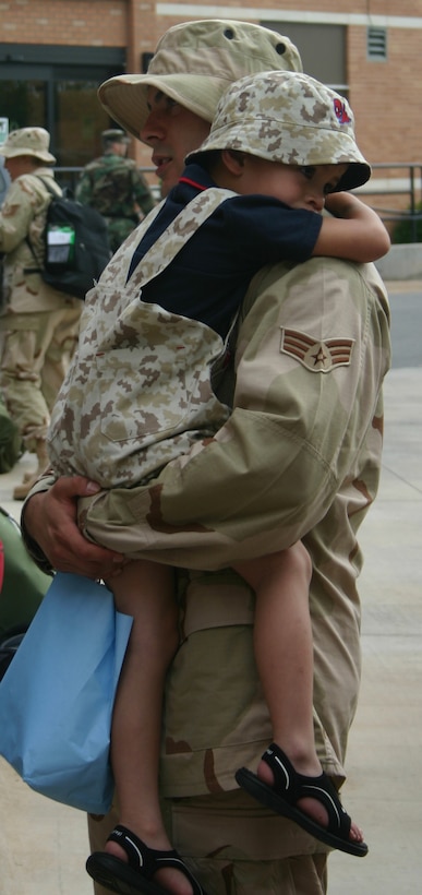 Leaving family members behind is the hardest part when Air Force members are tasked to deploy. Here, Senior Airman Andrew Aragon holds his son May 7 prior to his deployment. Airman Aragon is a member of the 82nd Medical Operations Squadron. (U.S. Air Force photo/John Ingle) 