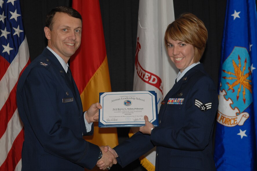 Colonel Earl D. Matthews, 435th Air Base Wing commander, presents certificate to graduate Senior Airman Kerry, Solan-Johnson from the 435th Public Affairs Squadron, during the graduation of Airman Leadership School class of 2007.



