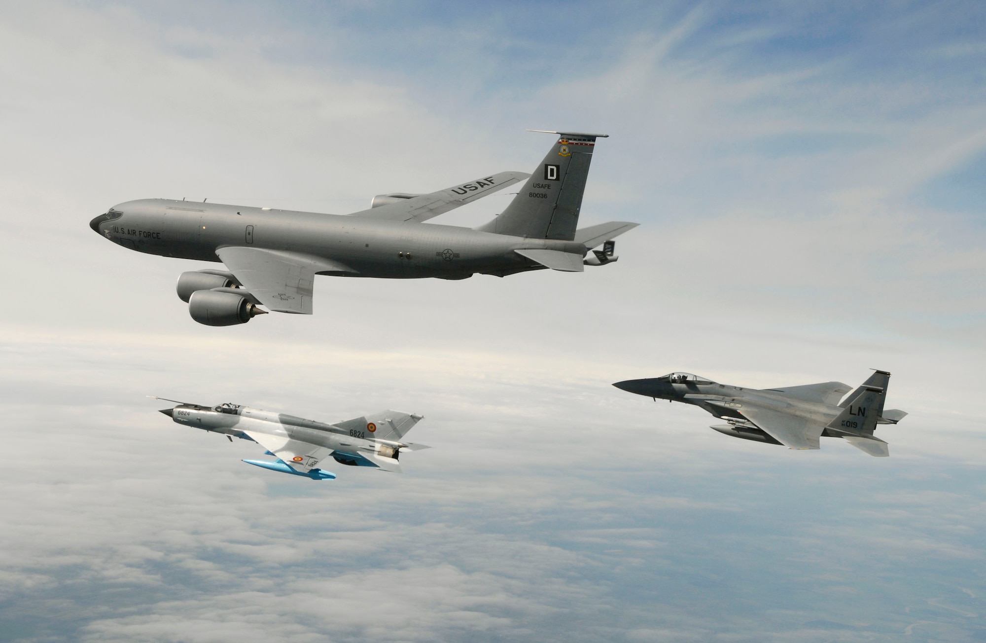 MIHAIL KOGALNICEANU, ROMANIA – 1st Lt. Andrew Weidner, an F-15 “Eagle” pilot assigned to the 493rd Fighter Squadron at RAF Lakenheath, and a Romanian MiG-21 fly along side a KC-135 “Stratotanker” from  RAF Mildenhall’s 351st Air Refueling Squadron during a training mission over Eastern Romania Wednesday.  More than 200 U.S. Air Forces in Europe Airmen, mostly from RAF Lakenheath and Mildenhall, are in Romania participating in Exercise Sniper Lance 2007.  “Sniper Lancer” is being staged out of Mihail Kogalniceanu Air Base near the Eastern Coast of Romania.  (Photo by Ben Bloker, European Stars & Stripes)