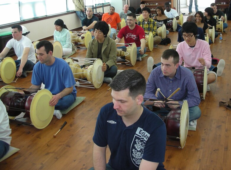 GYEONGGI, Republic of Korea --  Participants of the 8th Army's Head Start Program practice playing traditional drums at the Gyeonggi Traditional Music Center recently. (U.S. Air Force photo)