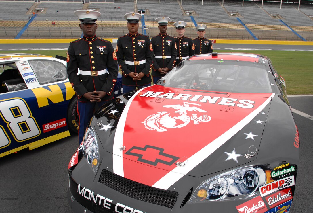 Five U. S. Marines stand next to the FedEx Marine car during the unveiling ceremonies in Victory Lane at Lowe's Motor Speedway in recognition of "American Heroes Memorial Day Salute to the Armed Forces" at the Lowe's Motor Speedway Charlotte, N.C., May 8. Photo by William D. Moss