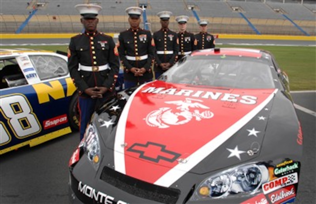 Five U. S. Marines stand next to the FedEx Marine car during the unveiling ceremonies in Victory Lane at Lowe's Motor Speedway  in recognition of   "American Heroes Memorial Day Salute to the Armed Forces" at the Lowe's Motor Speedway Charlotte, N.C.,  May 8, 2007.