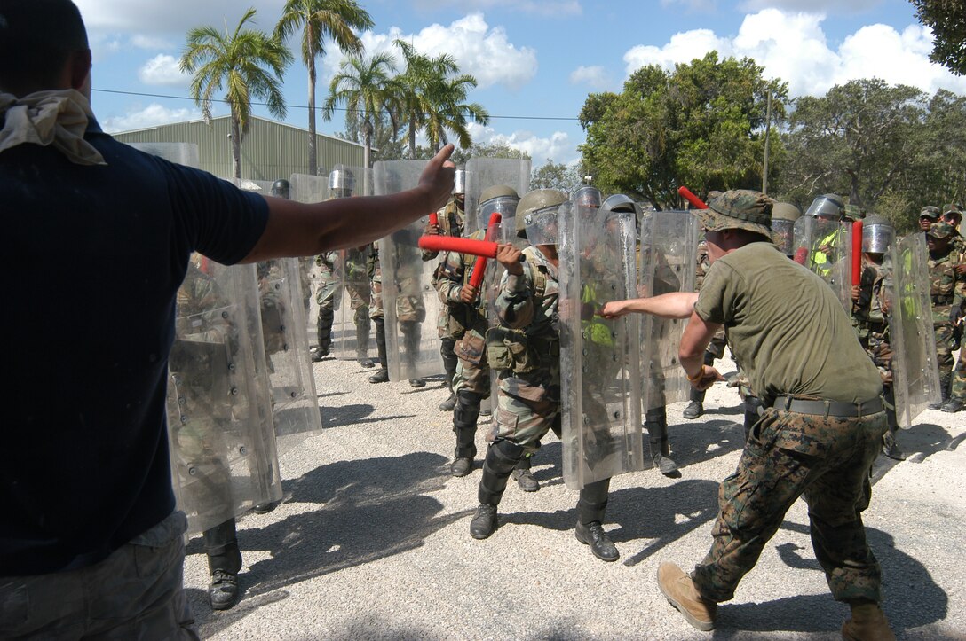 PRICE BARRACKS, Belize - Lance Cpl. Pat Minner, Kilo Company, 3rd Battalion, 24th Marine Regiment, taunts the base line of shields during crowd control training here May 8. The training was part of exercise Trade Winds 2007. (Official U. S. Marine Corps photo by Sgt. G. S. Thomas)