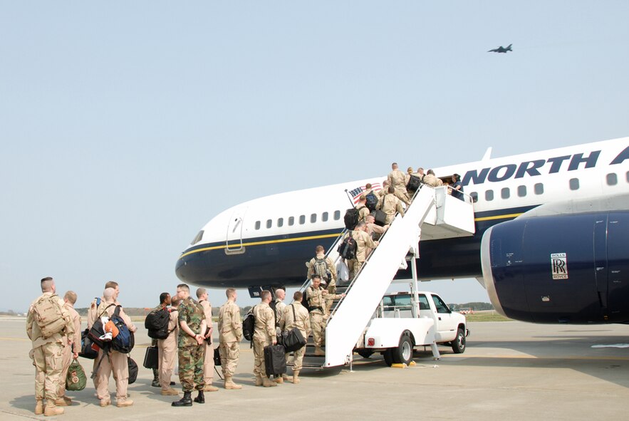 MISAWA AIR BASE, Japan -- Misawa Airmen board a chartered jet which will fly them to Iraq for their Air Expeditionary Force 7/8 deployment this month. Most of the Airmen deploying are from the 13th Fighter Squadron who are replacing Misawa's 14th Fighter Squadron at Balad Air Base, Iraq, this month. (U.S. Air Force photo by Senior Airman Laura McFarlane)