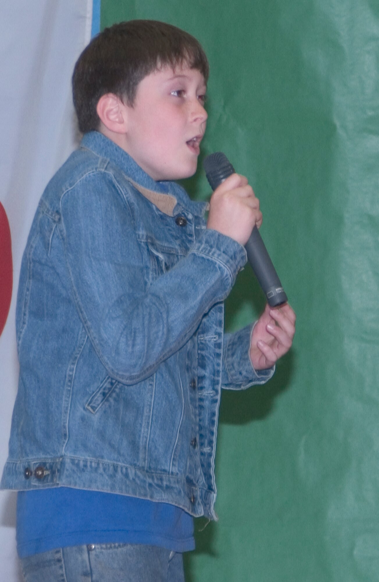 MISAWA AIR BASE, Japan --  Collin Lyon sings "Right Here Waiting" at the Misawa Youth Idol Competition held at the Lunney Youth Center May 5. Collin was the male winner of the competion and received a $100 Army and Air Force Exchange Service gift certificate. (U.S. Air Force photo by Airman 1st Class Eric Harris) 
