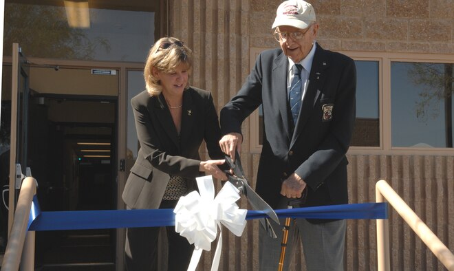 Ms. Jonna Doolittle Hoppes, General James Doolittle’s granddaughter, and Maj. Gen. (Retired) David Jones, a "Doolittle Raider," cut the ribbon at the grand opening of the General James H. Doolittle Center here May 9. 
