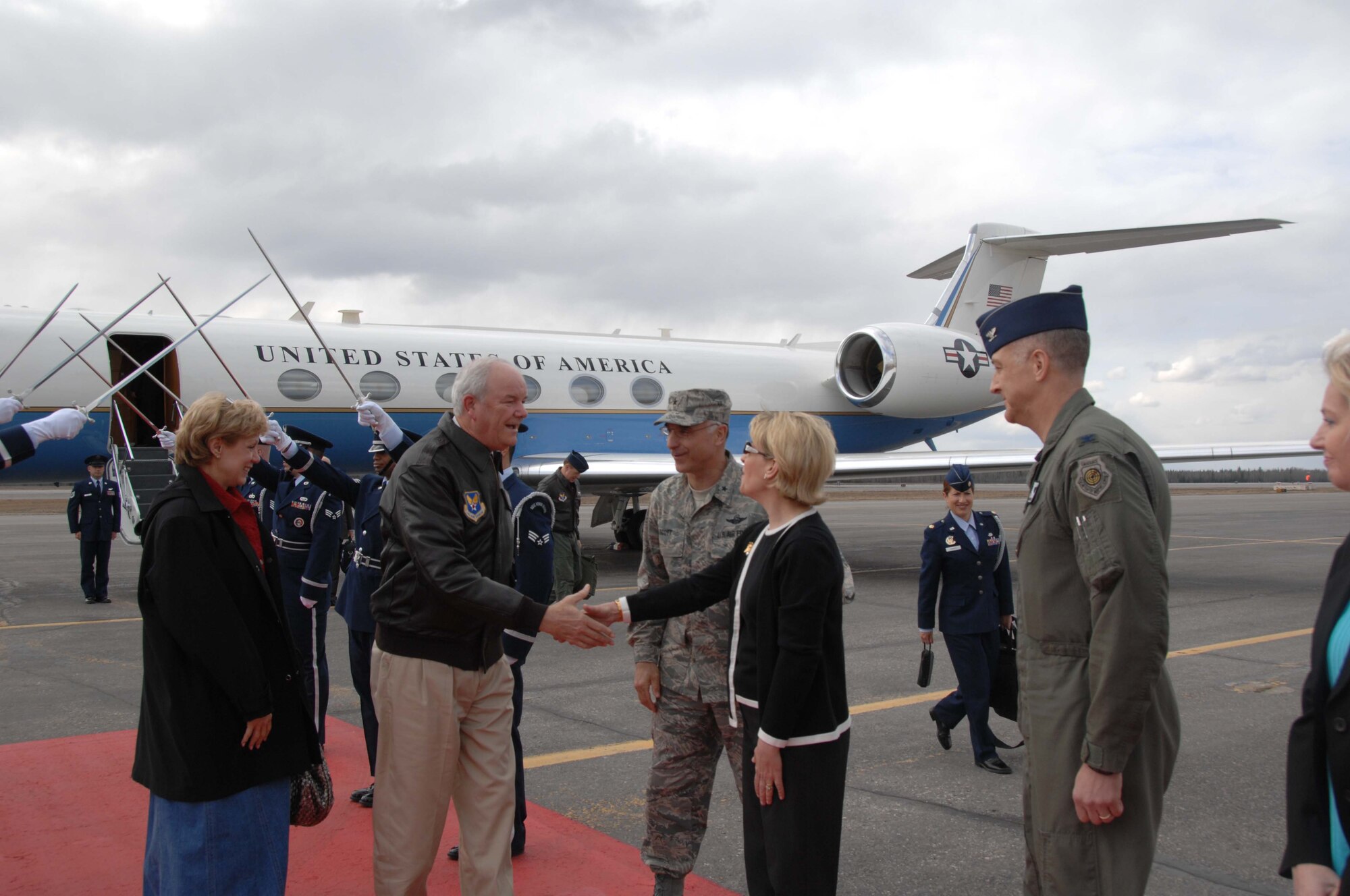 EIELSON AIR FORCE BASE, Alaska -- Secretary of the Air Force Michael W. Wynne greets Lisa Scott, 354th Fighter Wing Commander's spouse upon arrival at Eielson AFB, AK. on May 08. The 21st Secretary of the Air Force is currently touring the Pacific Region to introduce his top priorities for the Air Force -- winning the war on terrorism, Fostering mutual integrity and respect, and revitalizing for the service's aging infrastructure and fleet. (U.S. Air Force photo taken by Staff Sergeant Tia C. Schroeder) 