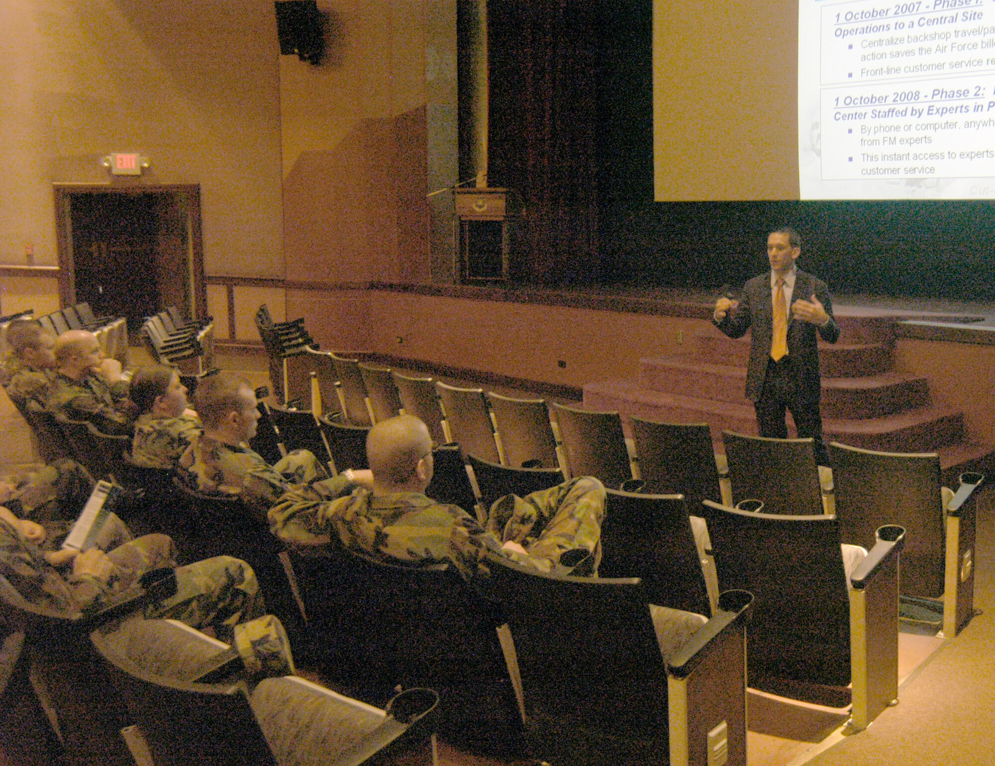 Ken Chin, financial services transition team member, speaks to Warren Airmen about how the financial services transition is going to affect Warren and other Air Forces bases during a meeting in the base theater April 26. The Air Force may save almost $200 million by creating a consolidated financial services center at Ellsworth Air Force Base, S.D. The center is meant to standardize financial services across the Air Force and offer 24-hour customer service. The first transition phase occurs at Warren Oct. 19 through 22. For more information visit http://www.affsc.hq.af.mil (Photo by 2nd Lt. Lisa Meiman).