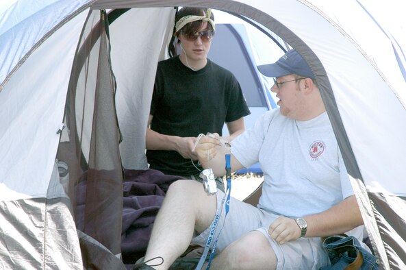 Chris Gowen and Shawn Clinch from the Boy Scout Apoxkyaio lodge in Montana finish setting up their tent outside the Warren Youth Center Saturday. The overnight event was for members of the Order of the Arrow, a Boy Scout honor society. Among other things, scouts set up information booths about their lodges, had a lip synch contest and “pied” their chiefs (Photo by 2nd Lt. Lisa Meiman).