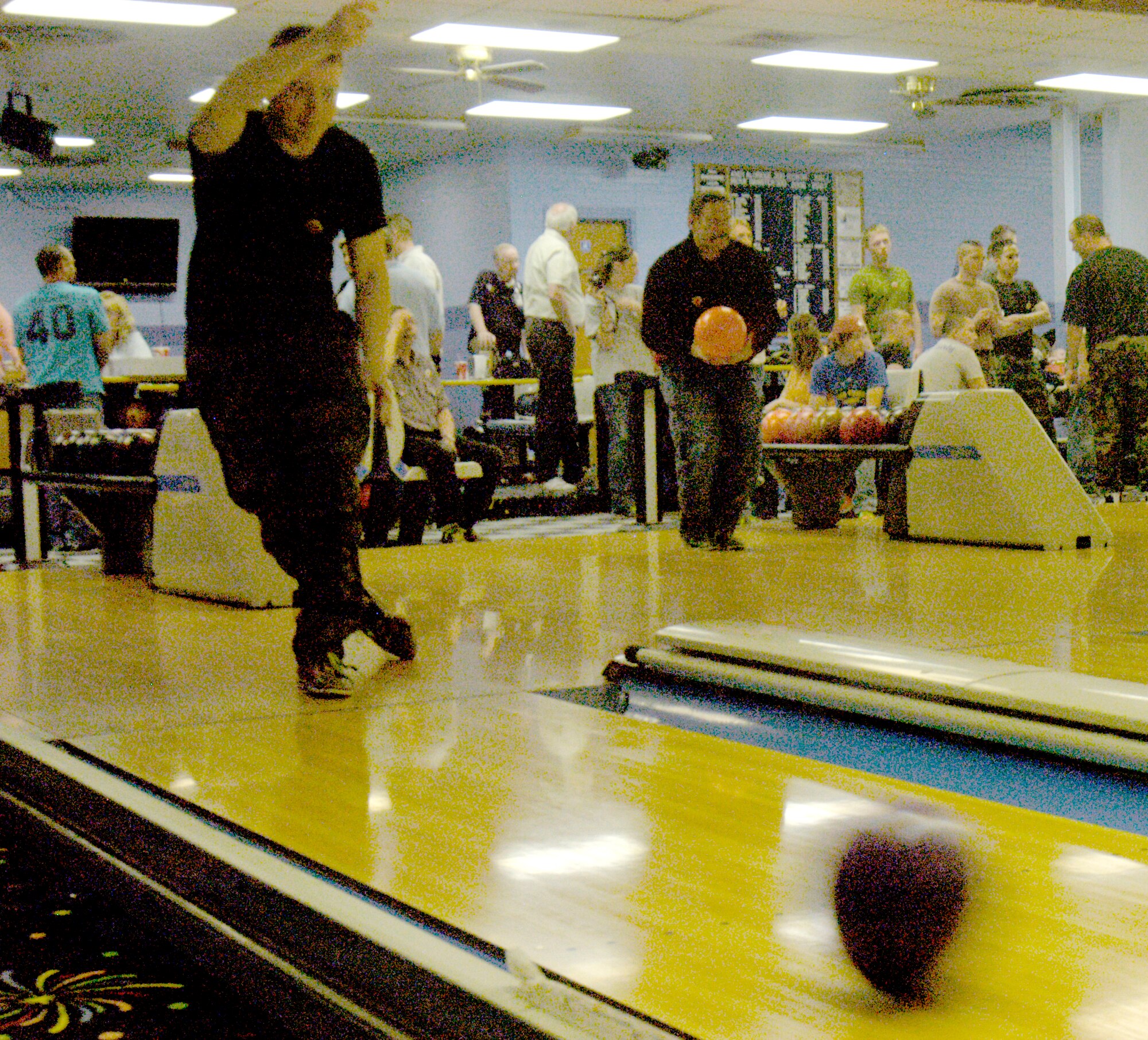 Staff Sgt. Daniel Young, 90th Maintenance Operations Squadron, bowls during a tournament at the Warren Bowling Center April 26. Twelve teams of six people competed for different prizes. The tournament was held to honor National Sexual Assault Awareness Month during April (Photo by 2nd Lt. Lisa Meiman).