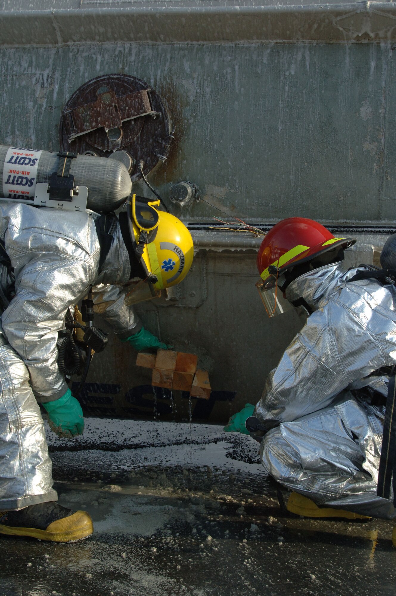 FAIRBANKS, Alaska (May 8, 2007) –Firefighters from the fire department here stop a leak from a tanker truck using wooden plugs and wedges as part of a train derailment scenario for Alaska Shield/Northern Edge 07.  AKS/NE 07 is a State of Alaska/US NORTHCOM sponsored homeland defense/defense support of civil authorities exercise; part of the national-level Ardent Sentry/Northern Edge 07. It’s an opportunity to practice responding to homeland defense and disaster events with the federal, state, local & private-sector team. U.S. Navy photo by Mass Communication Specialist 1st Class Daniel N. Woods