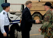 Dr. Ronald Sega, Under Secretary of the Air Force, and Col. Glen Joerger, 437th Airlift Wing commander, greet Lt. Col. John Pepin, 437th Aerial Port Squadron commander, at Charleston AFB, during a tour for Dr. Sega May 3. (U.S. Air Force photo/Airman 1st Class Nicholas Pilch)