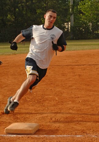 Jeffery Smart, 1st Combat Camera Squadron, rounds third base and heads for home  in the game against Boeing here Tuesday evening.  (U.S. Air Force photo/ Staff Sgt. April Quintanilla)